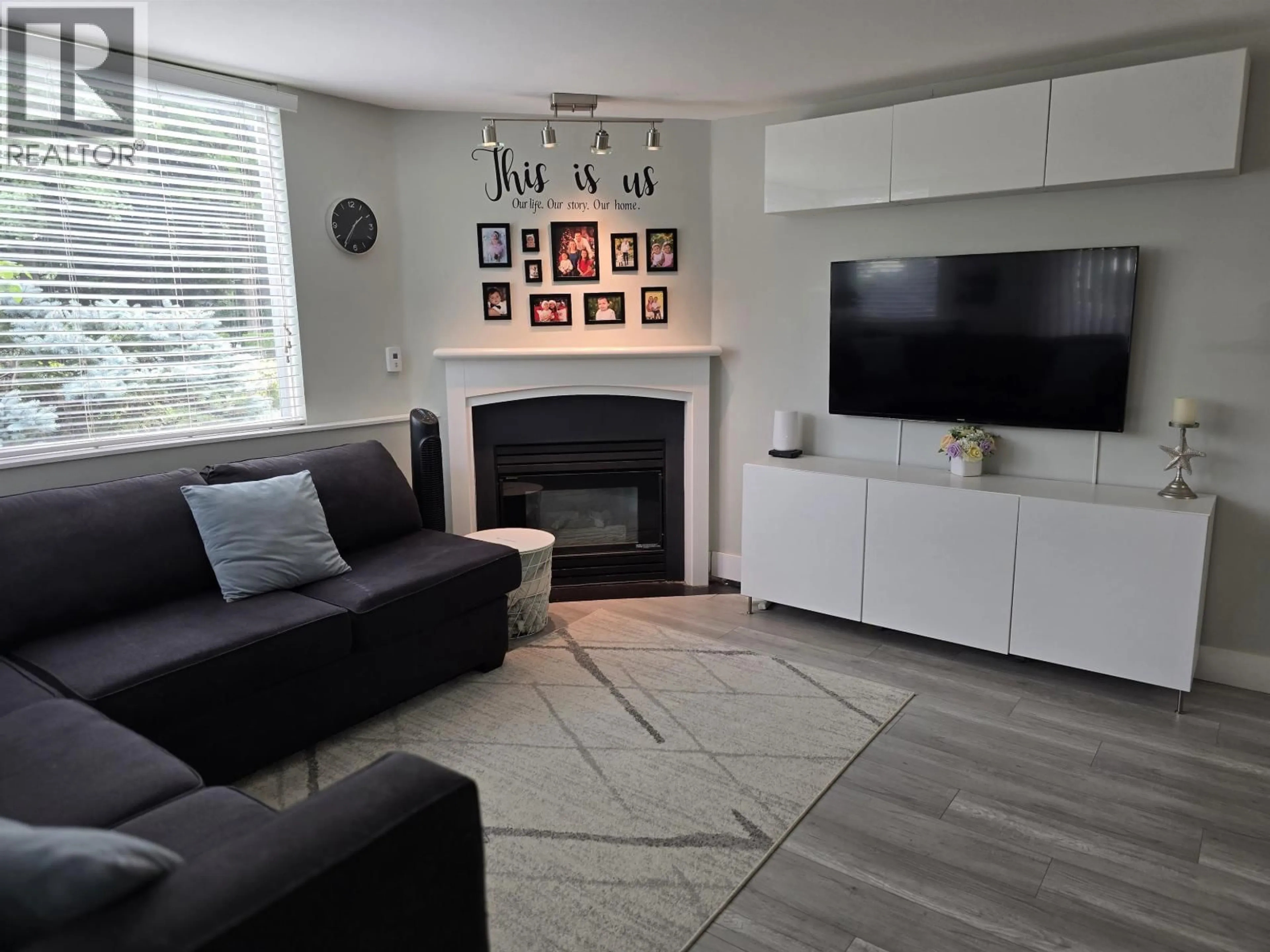 Living room with furniture, wood/laminate floor for 112 - 8460 JELLICOE STREET, Vancouver British Columbia V5S4S8