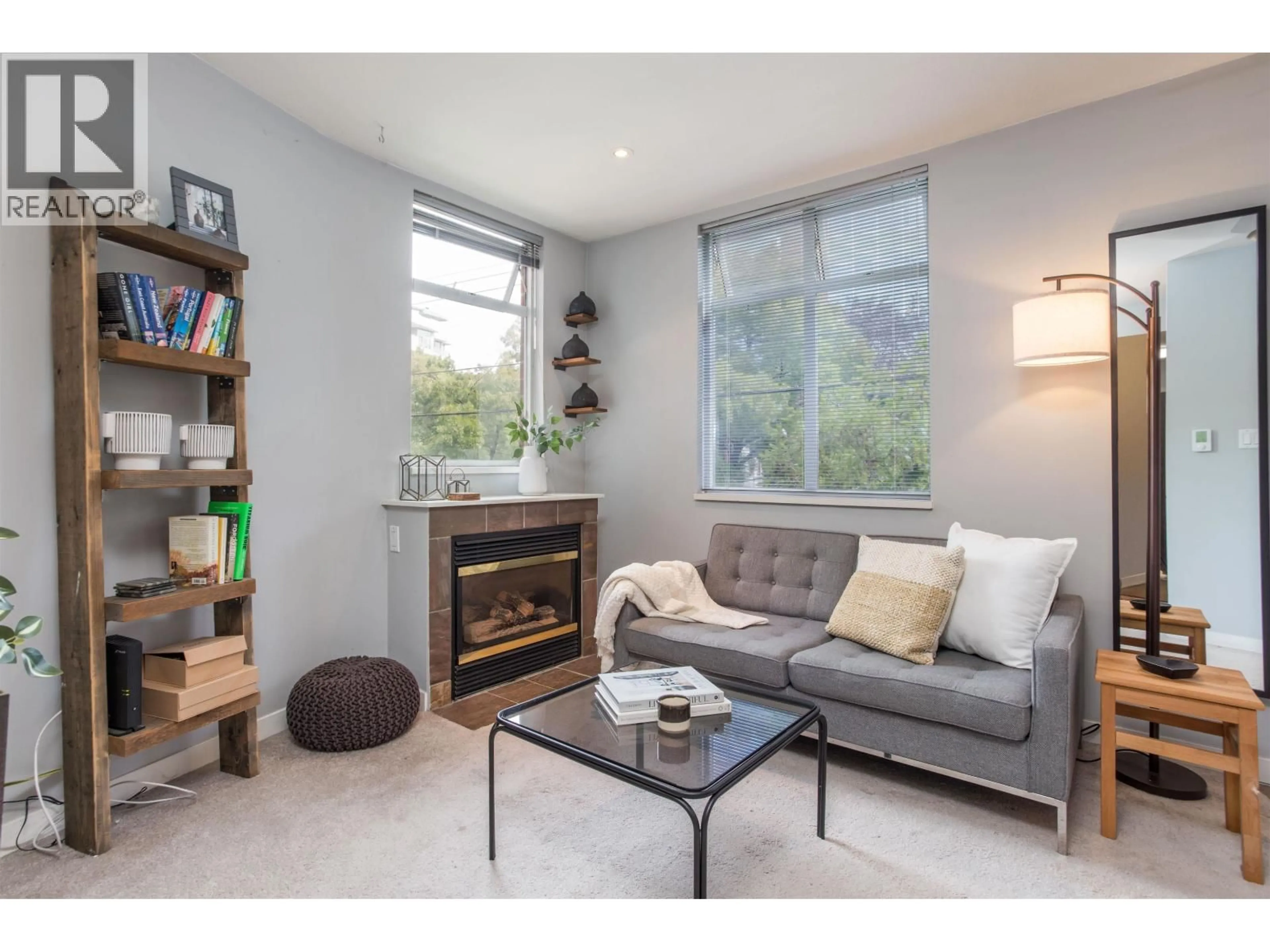 Living room with furniture, wood/laminate floor for 210 - 638 7TH AVENUE, Vancouver British Columbia V5Z1B5