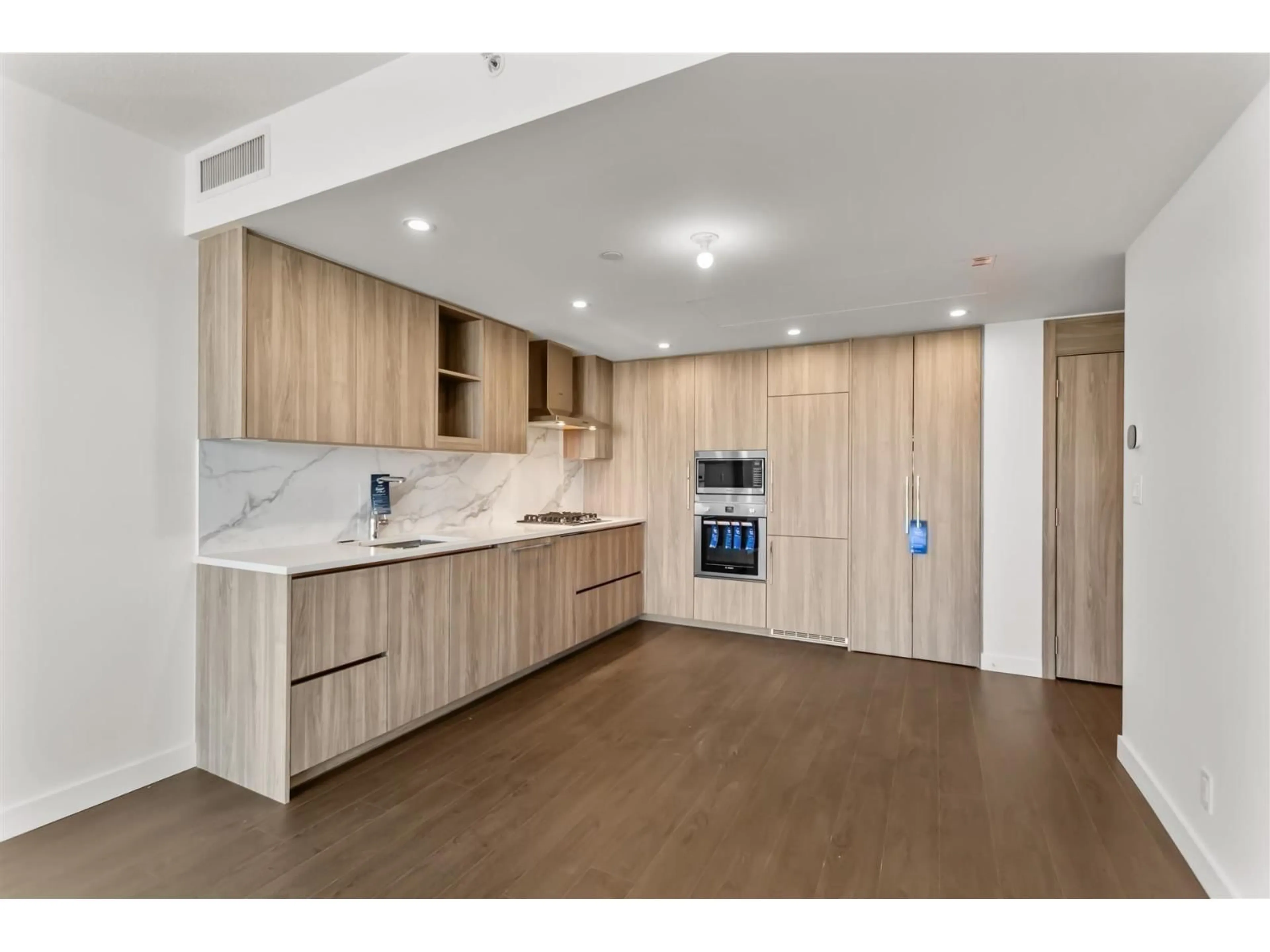 Open concept kitchen, wood/laminate floor for 3607 - 13768 100, Surrey British Columbia V3T0V2