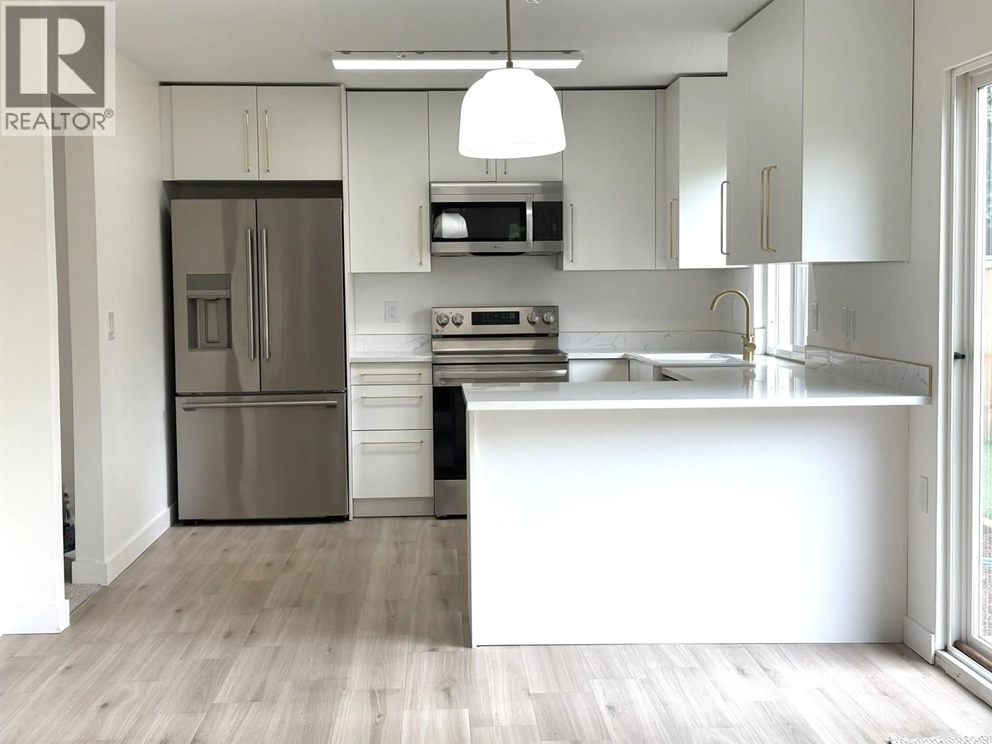 Open concept kitchen, wood/laminate floor for 1047 CORNWALL DRIVE, Port Coquitlam British Columbia V3B5X2