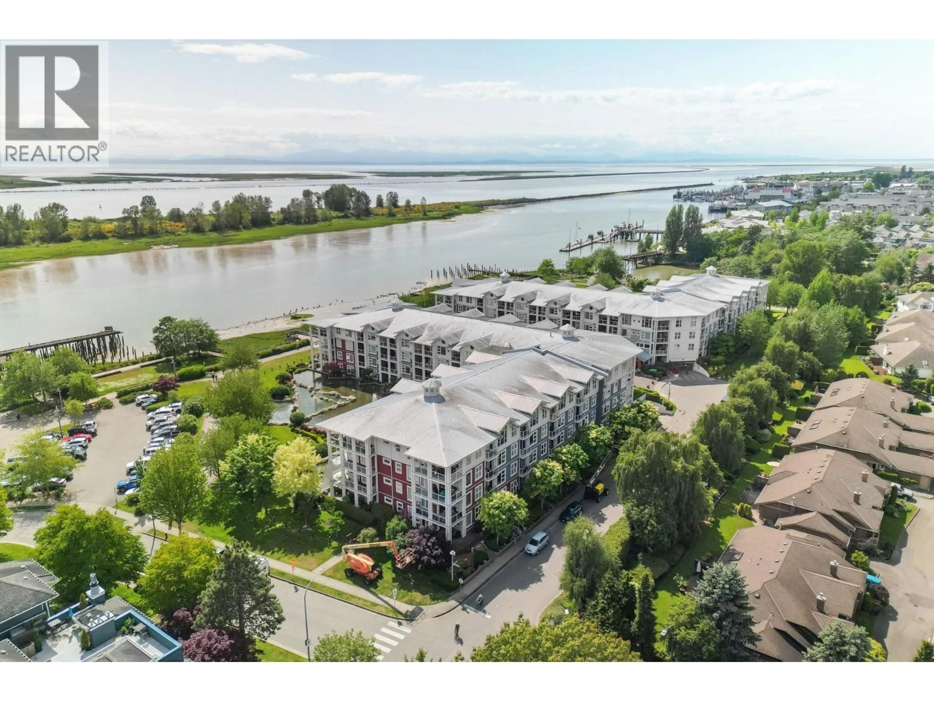 A pic from outside/outdoor area/front of a property/back of a property/a pic from drone, water/lake/river/ocean view for 204 - 4600 WESTWATER DRIVE, Richmond British Columbia V7E6S2