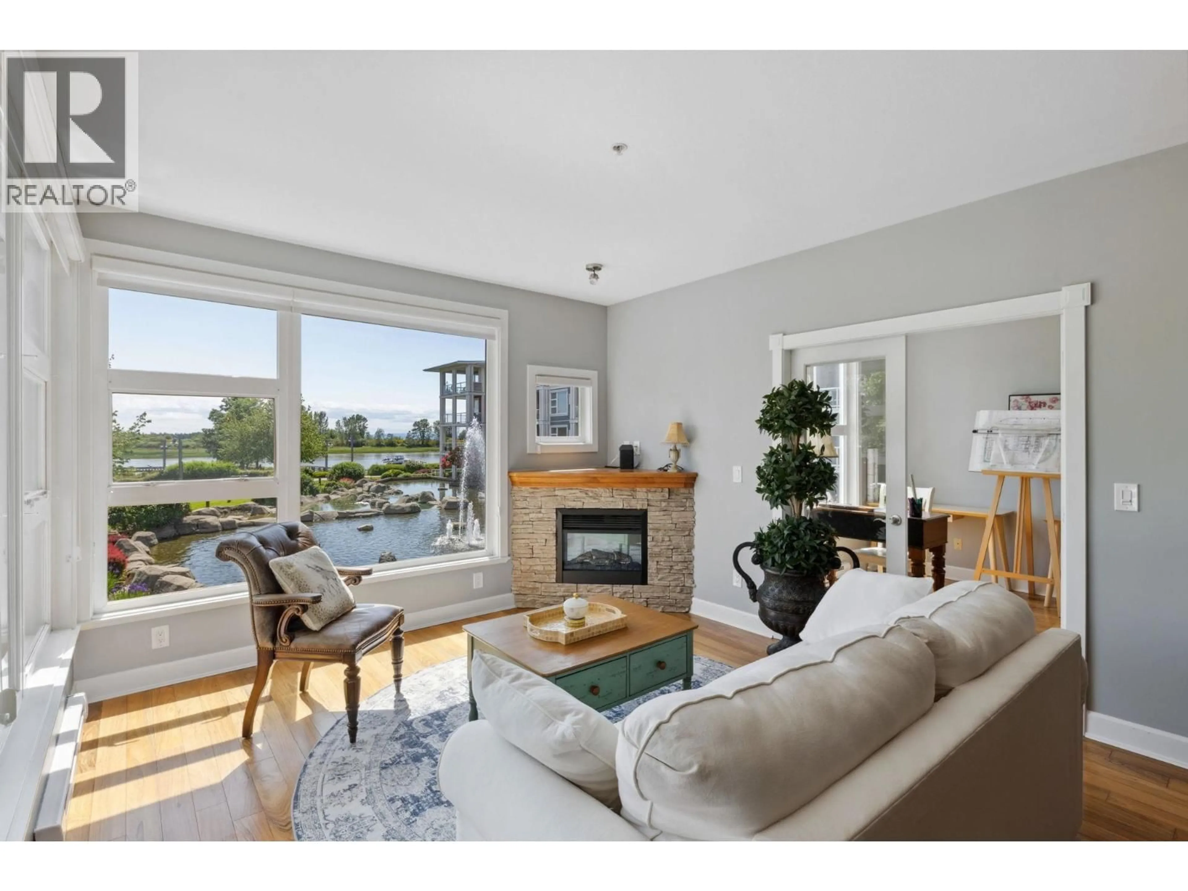 Living room with furniture, wood/laminate floor for 204 - 4600 WESTWATER DRIVE, Richmond British Columbia V7E6S2
