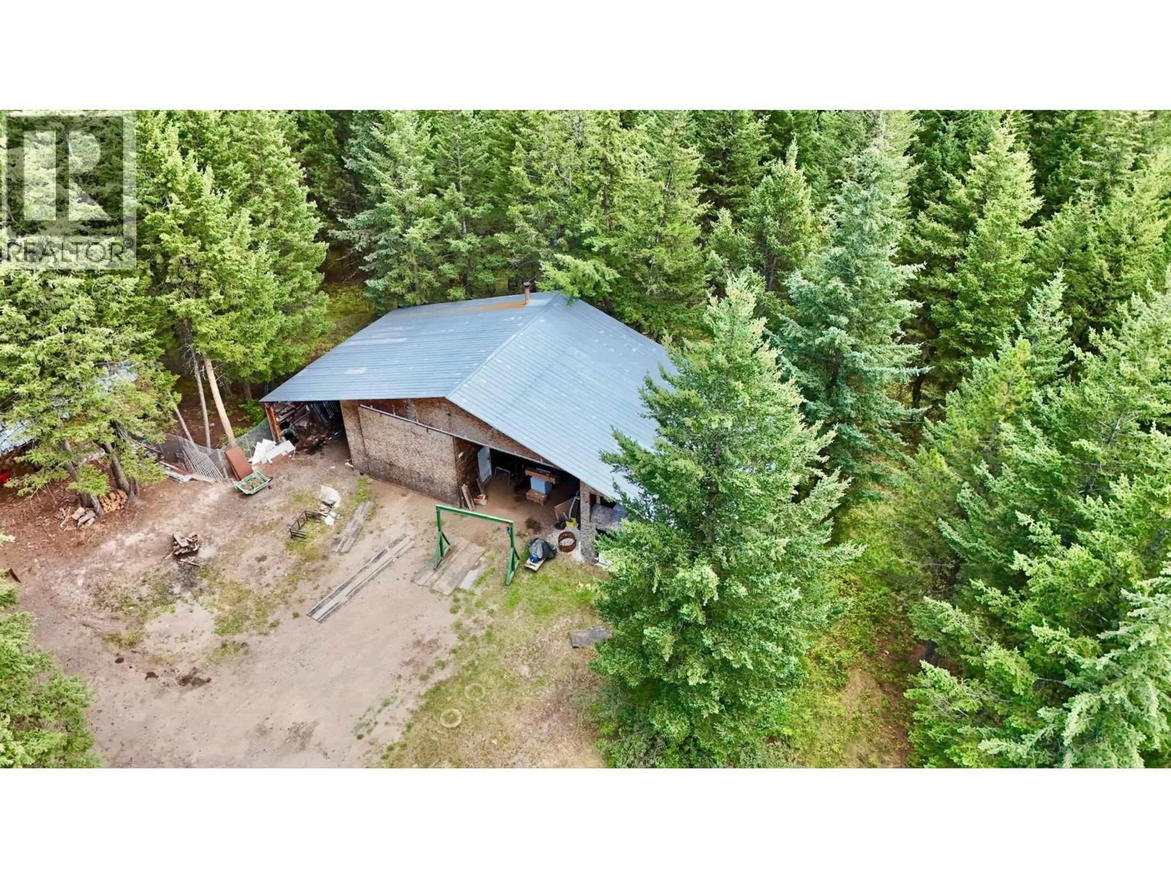 A pic from outside/outdoor area/front of a property/back of a property/a pic from drone, forest/trees view for 3448 SPOKIN LAKE ROAD, 150 Mile House British Columbia V0K2G0