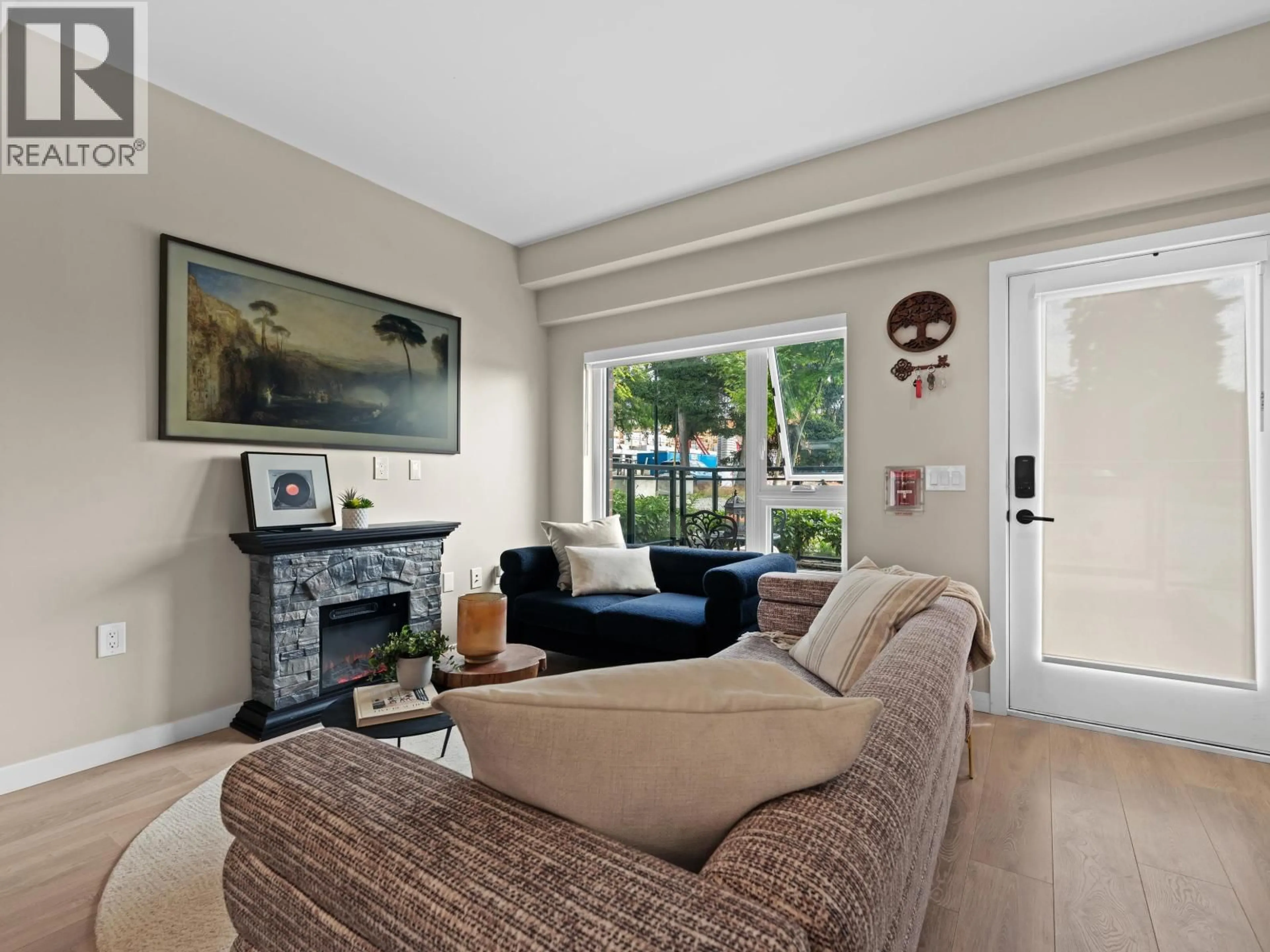Living room with furniture, unknown for 161 - 565 2ND STREET, North Vancouver British Columbia V7L1E1
