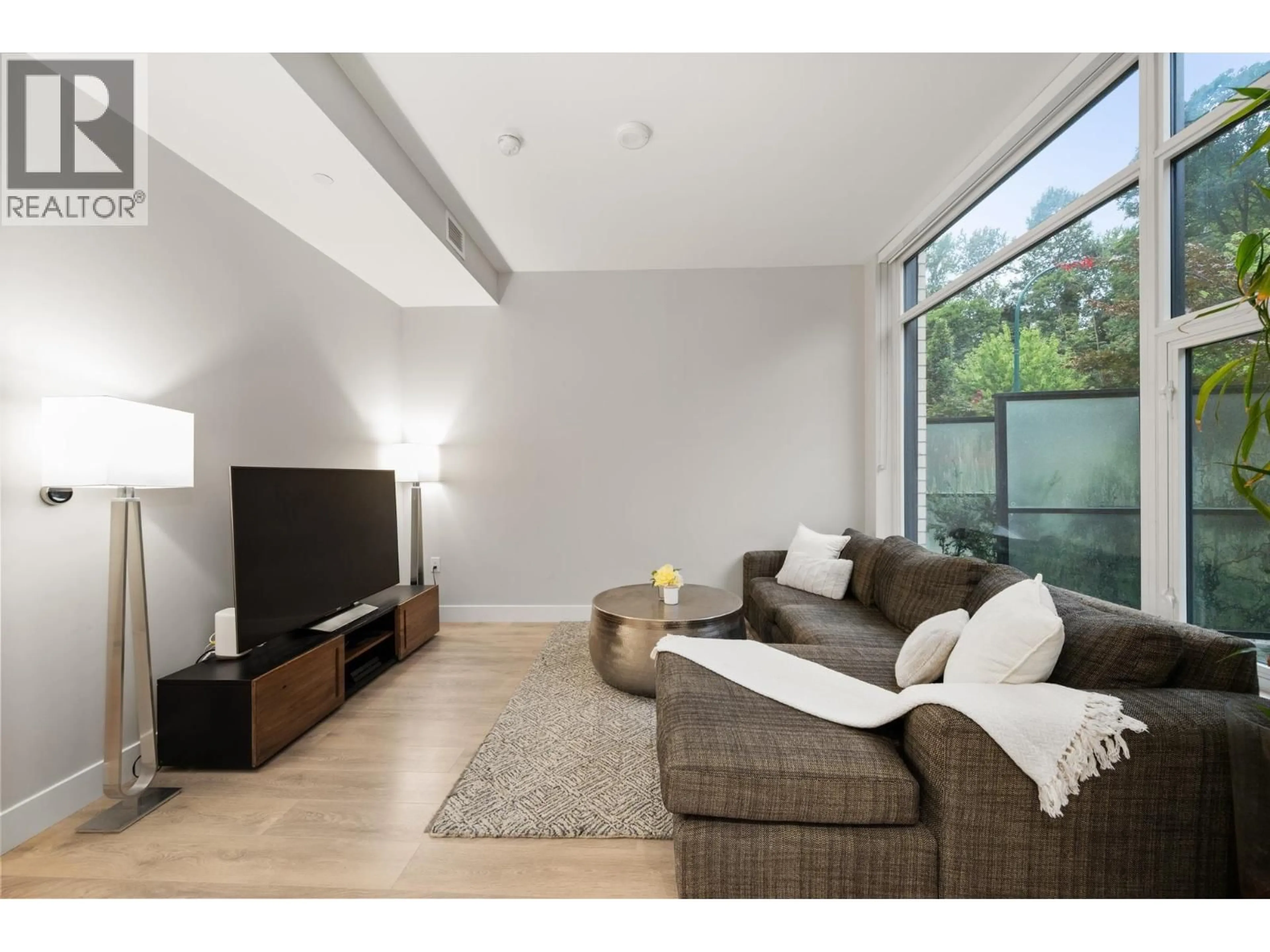 Living room with furniture, wood/laminate floor for 3482 MARINE WAY, Vancouver British Columbia V5S0H1