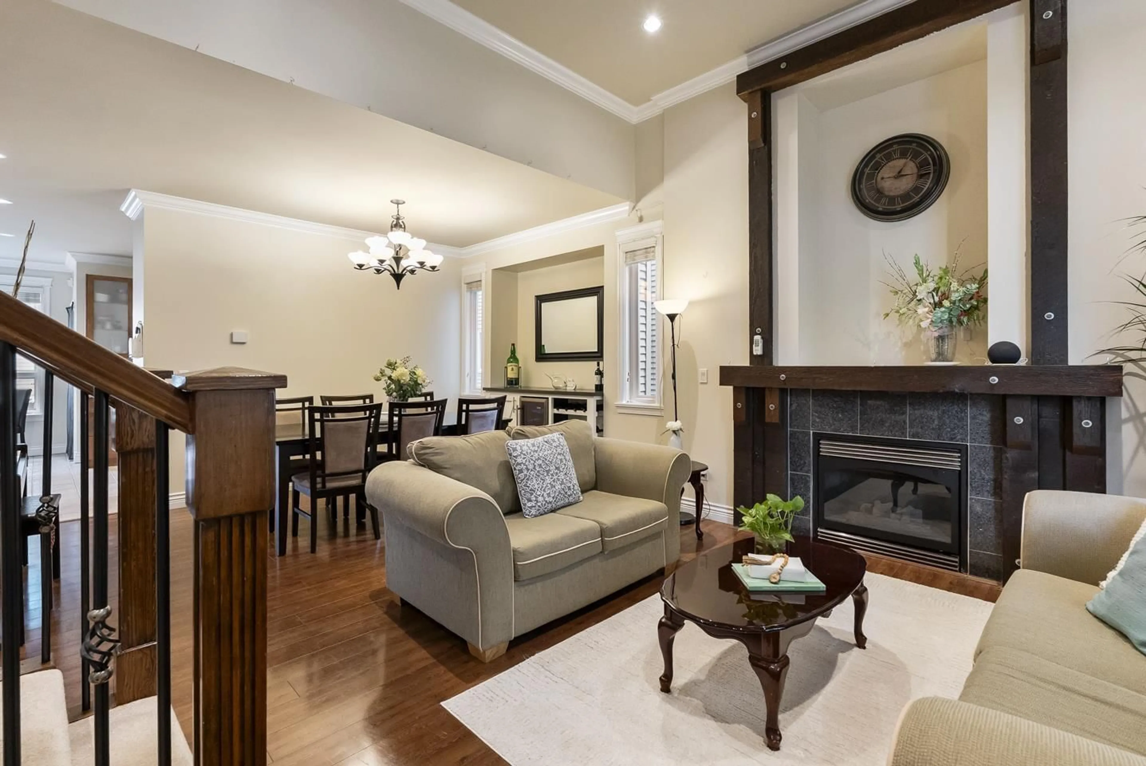 Living room with furniture, wood/laminate floor for 7114 148, Surrey British Columbia V3S3E4
