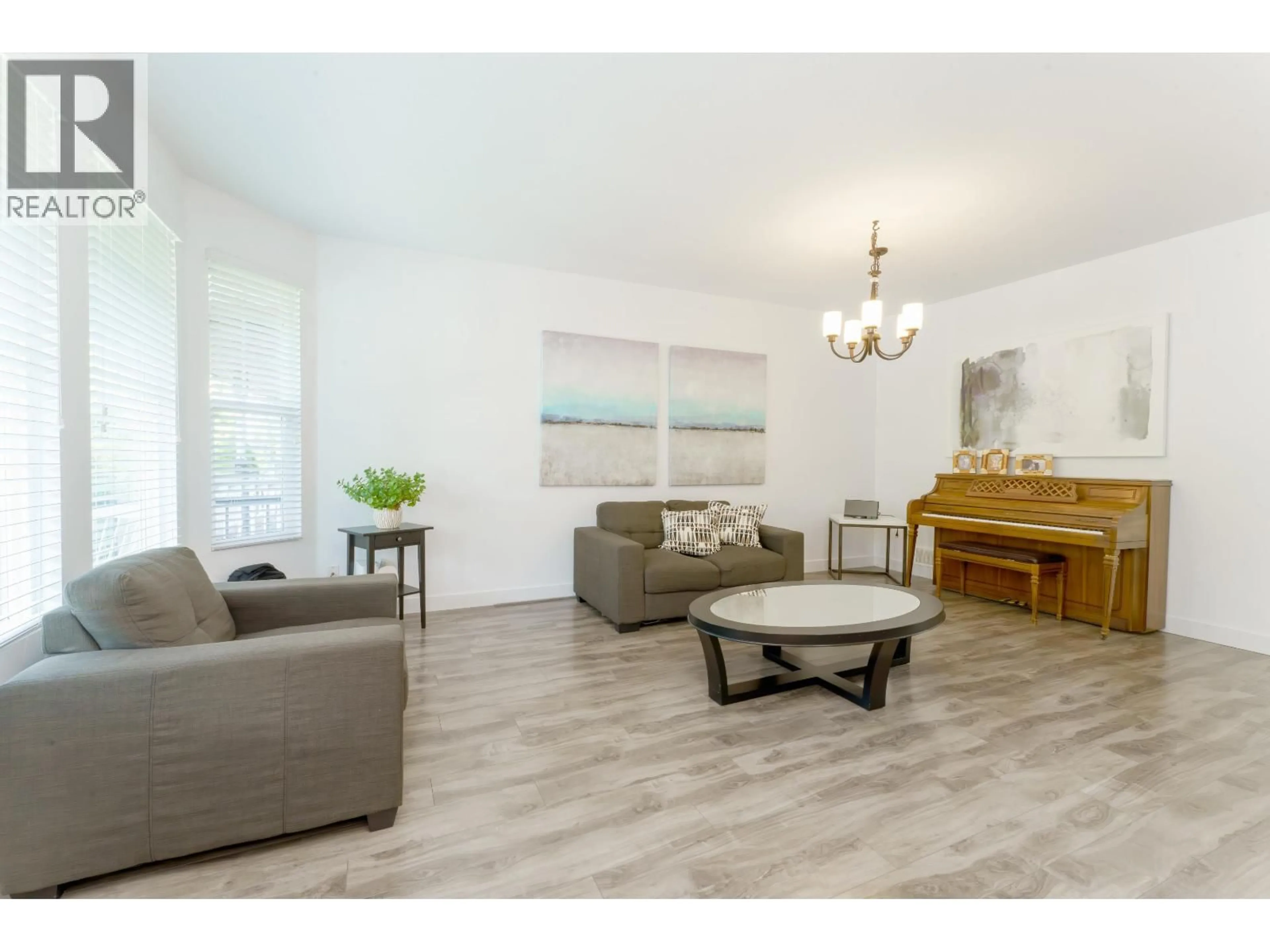 Living room with furniture, wood/laminate floor for 24386 101 AVENUE, Maple Ridge British Columbia V2W1W8