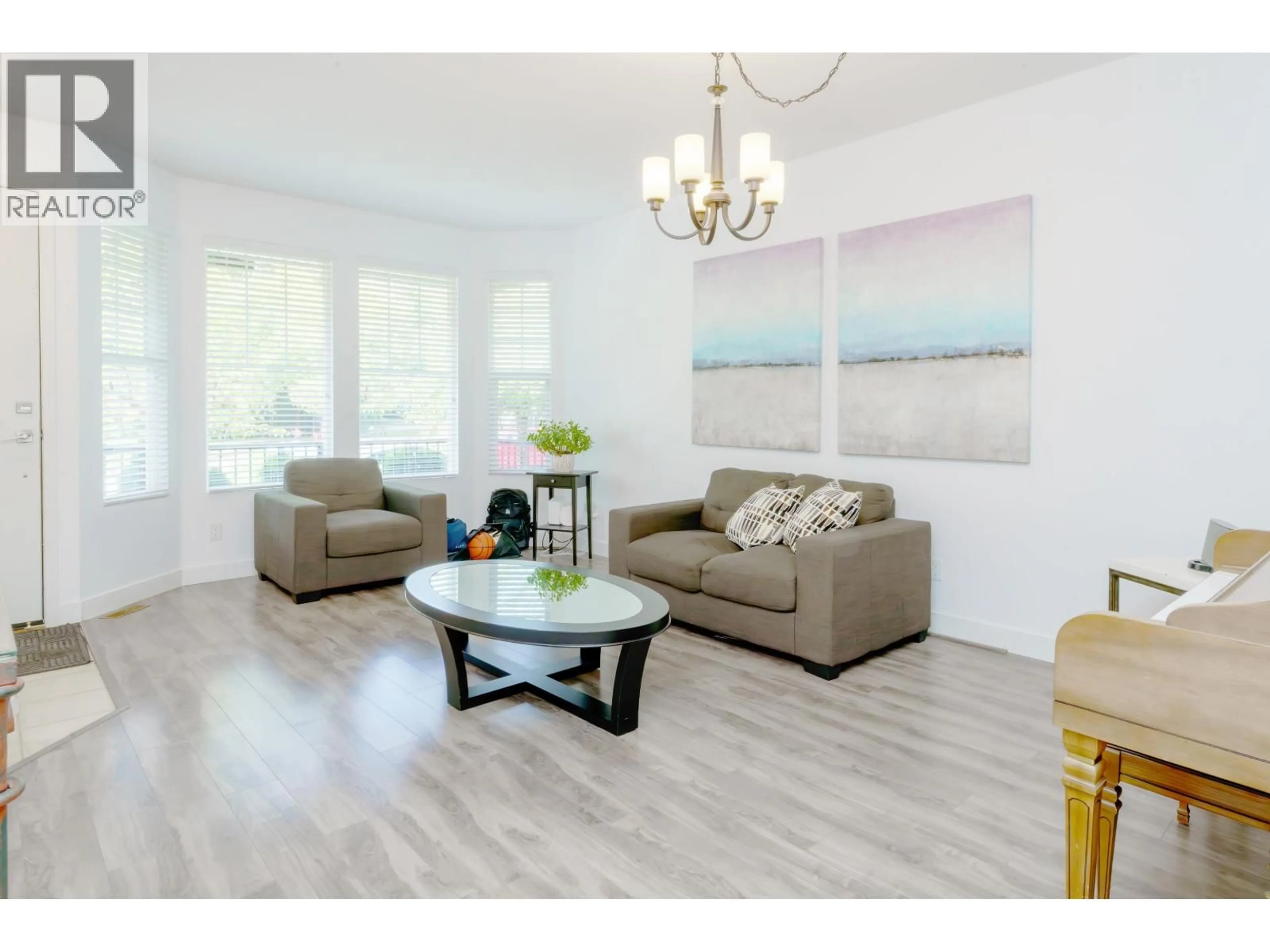 Living room with furniture, wood/laminate floor for 24386 101 AVENUE, Maple Ridge British Columbia V2W1W8
