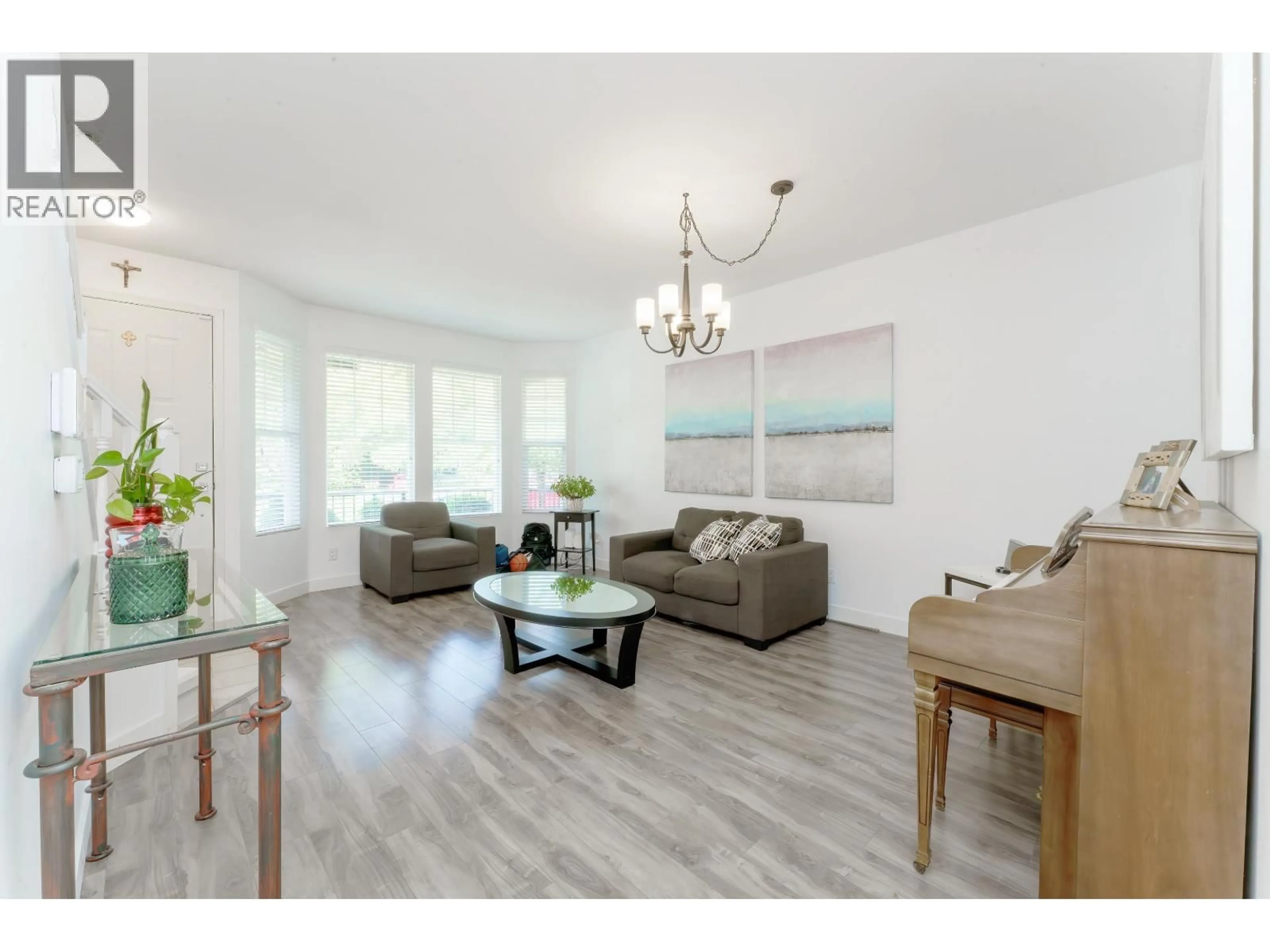 Living room with furniture, wood/laminate floor for 24386 101 AVENUE, Maple Ridge British Columbia V2W1W8