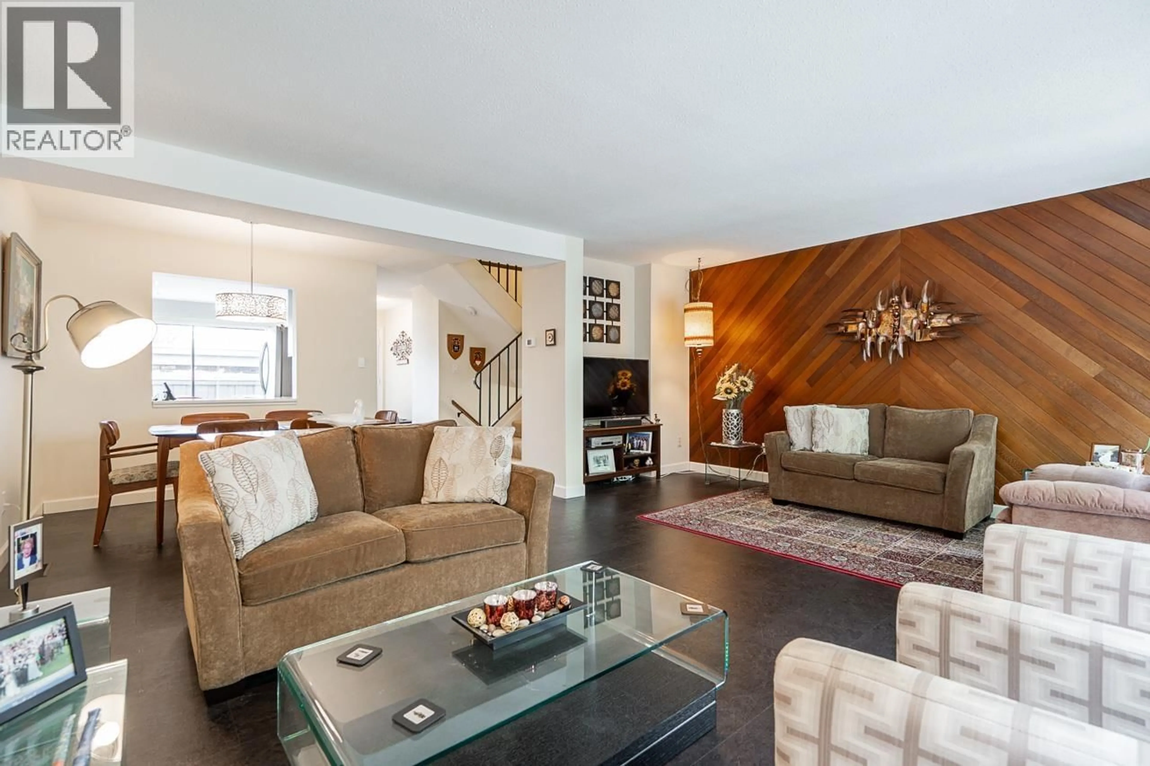 Living room with furniture, wood/laminate floor for 7379 MONTECITO DRIVE, Burnaby British Columbia V5A1R4