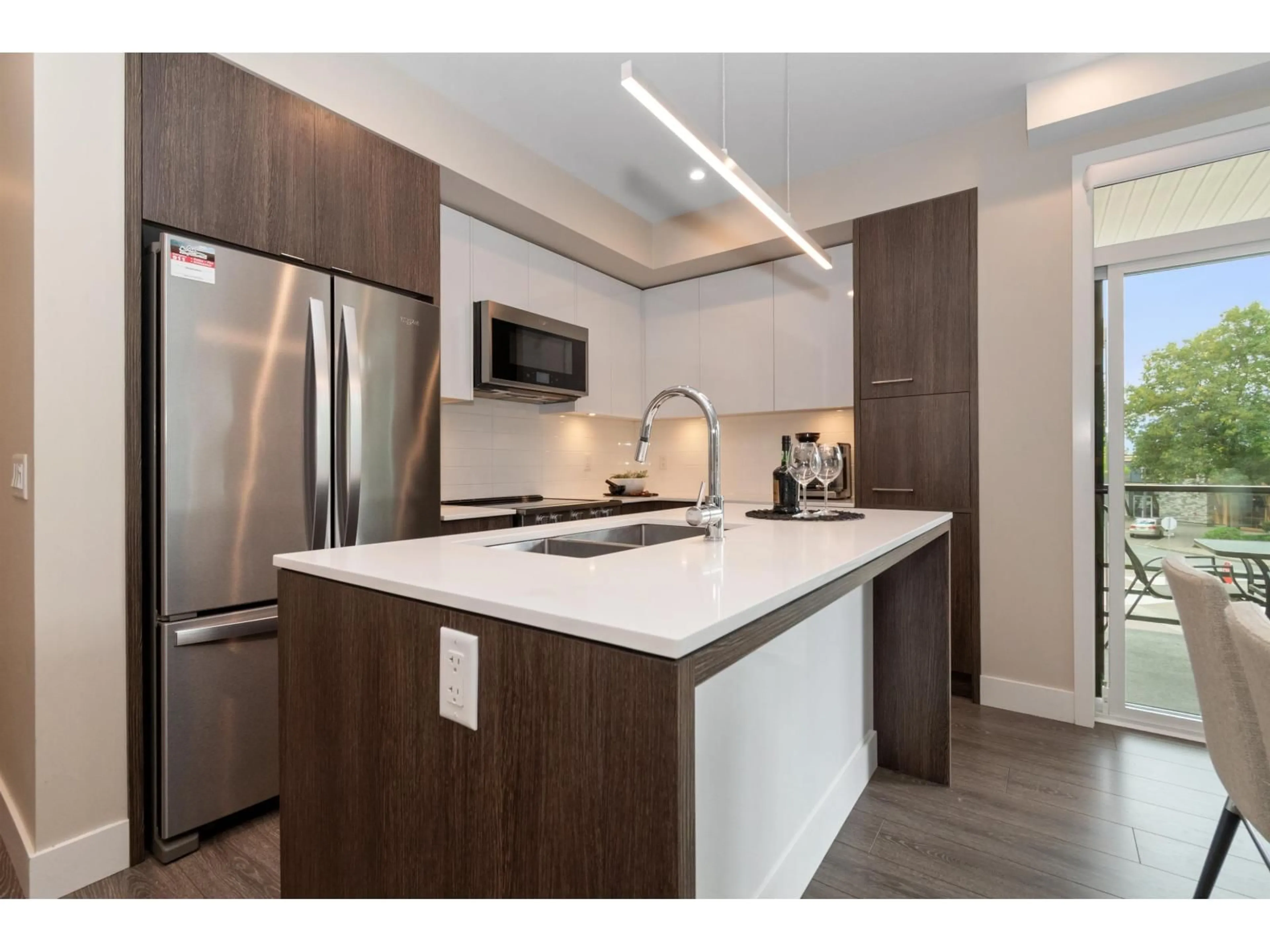 Open concept kitchen, wood/laminate floor for 204 - 45510 MARKET WAY, Chilliwack British Columbia V2R6E1