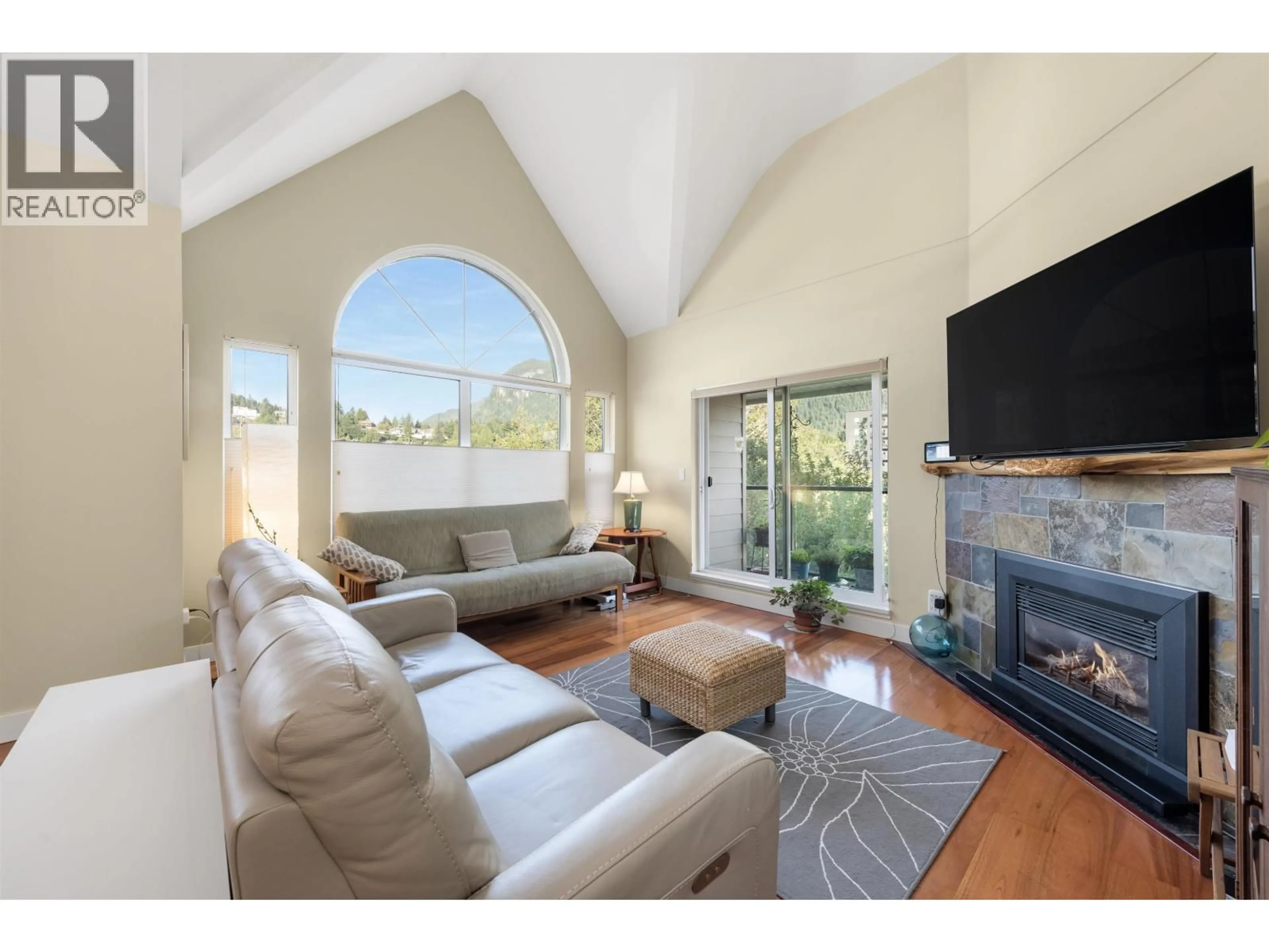Living room with furniture, unknown for 301 - 1468 PEMBERTON AVENUE, Squamish British Columbia V8B0K2