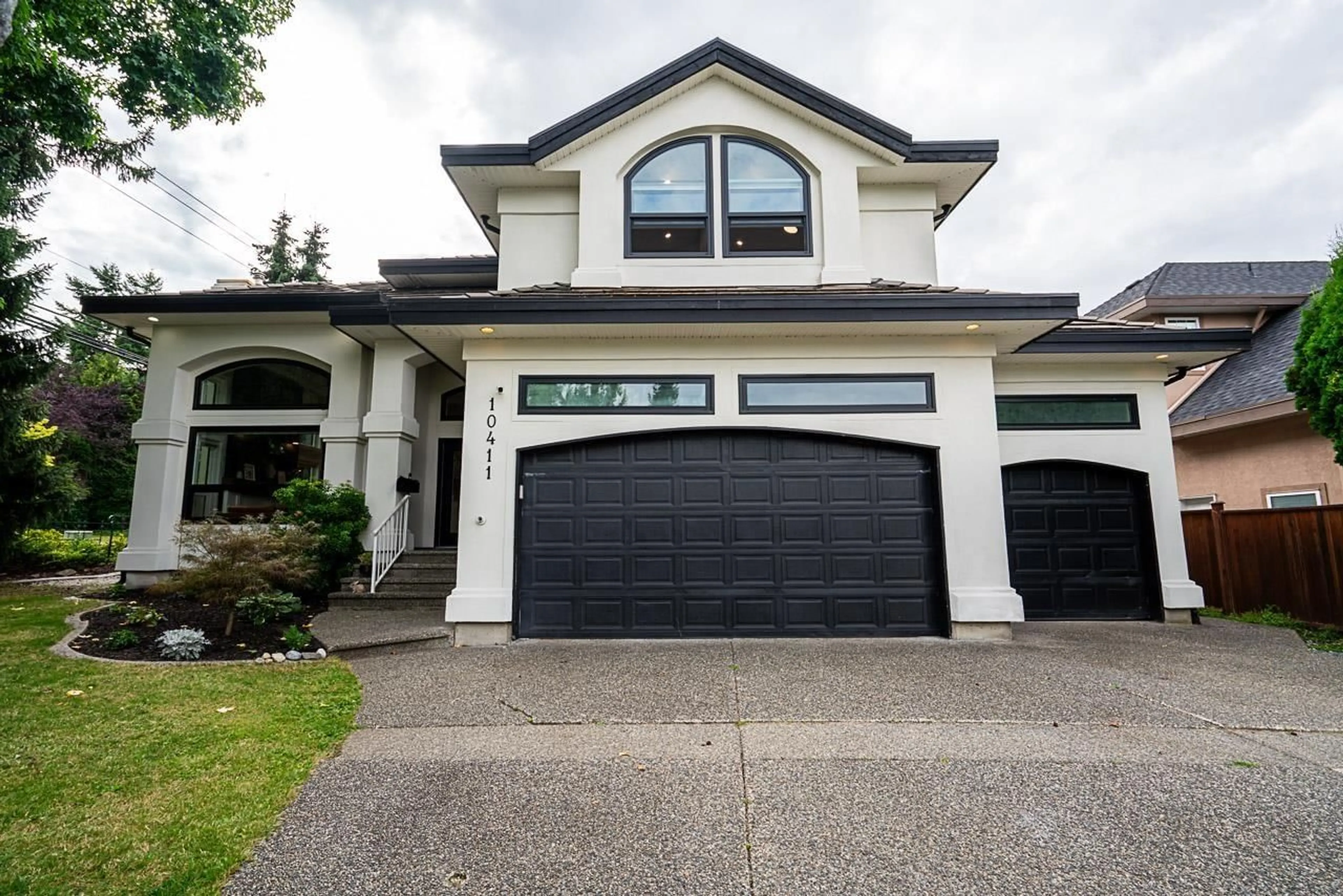 Home with vinyl exterior material, street for 10411 170A, Surrey British Columbia V4N4N9