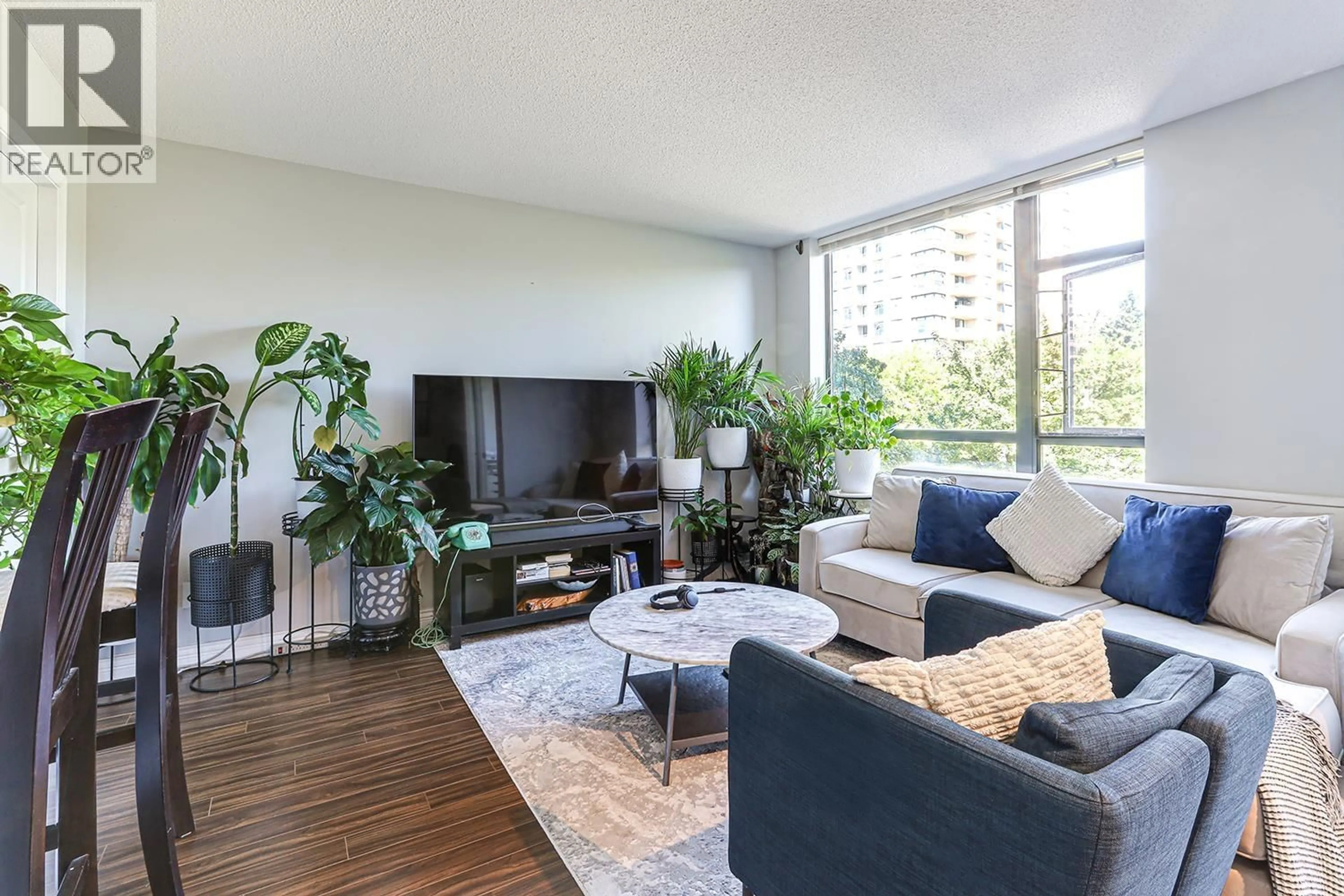 Living room with furniture, unknown for 308 - 3520 CROWLEY DRIVE, Vancouver British Columbia V5R6G9