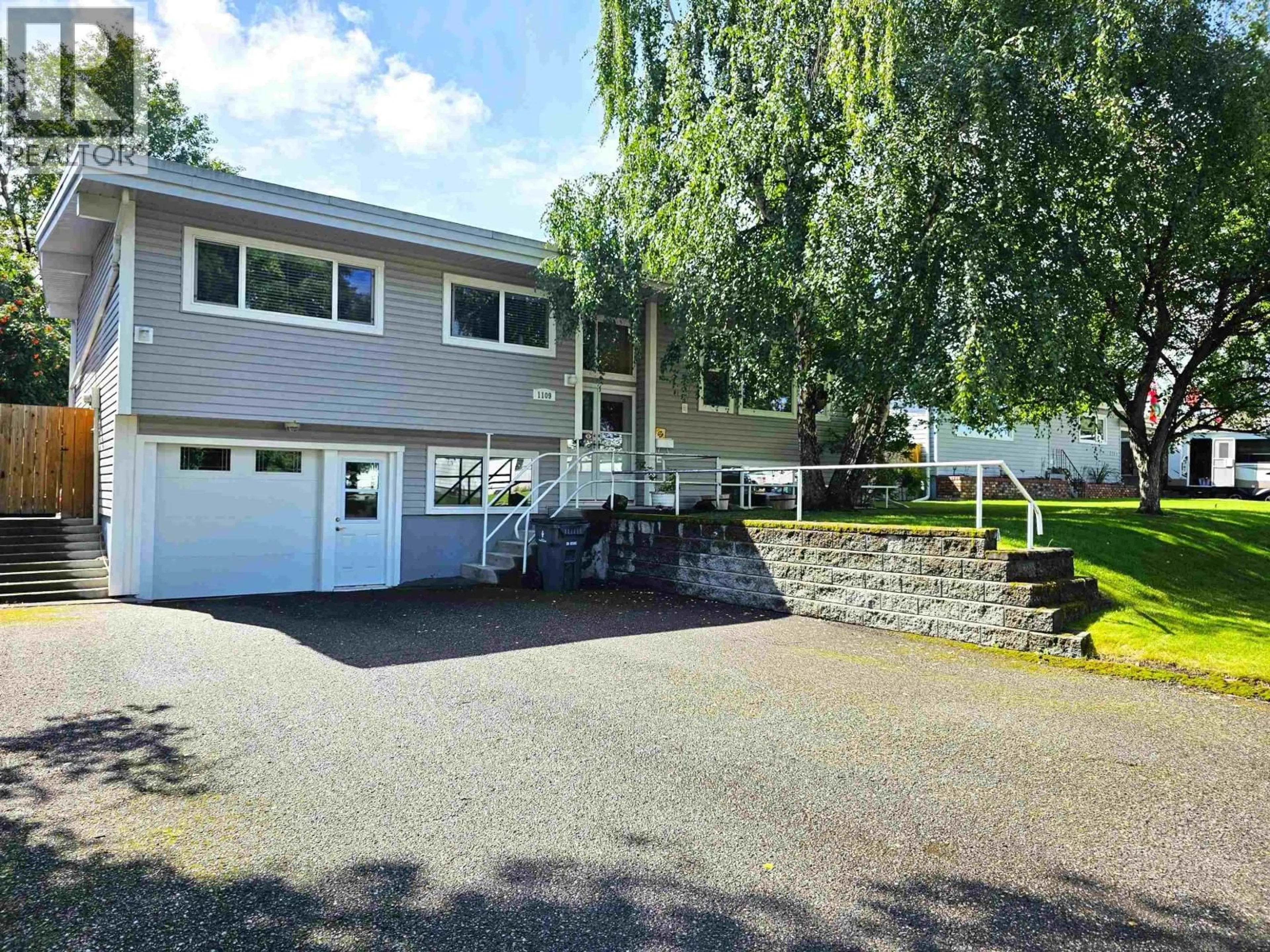 Home with vinyl exterior material, street for 1109 QUAW AVENUE, Prince George British Columbia V2M4C7