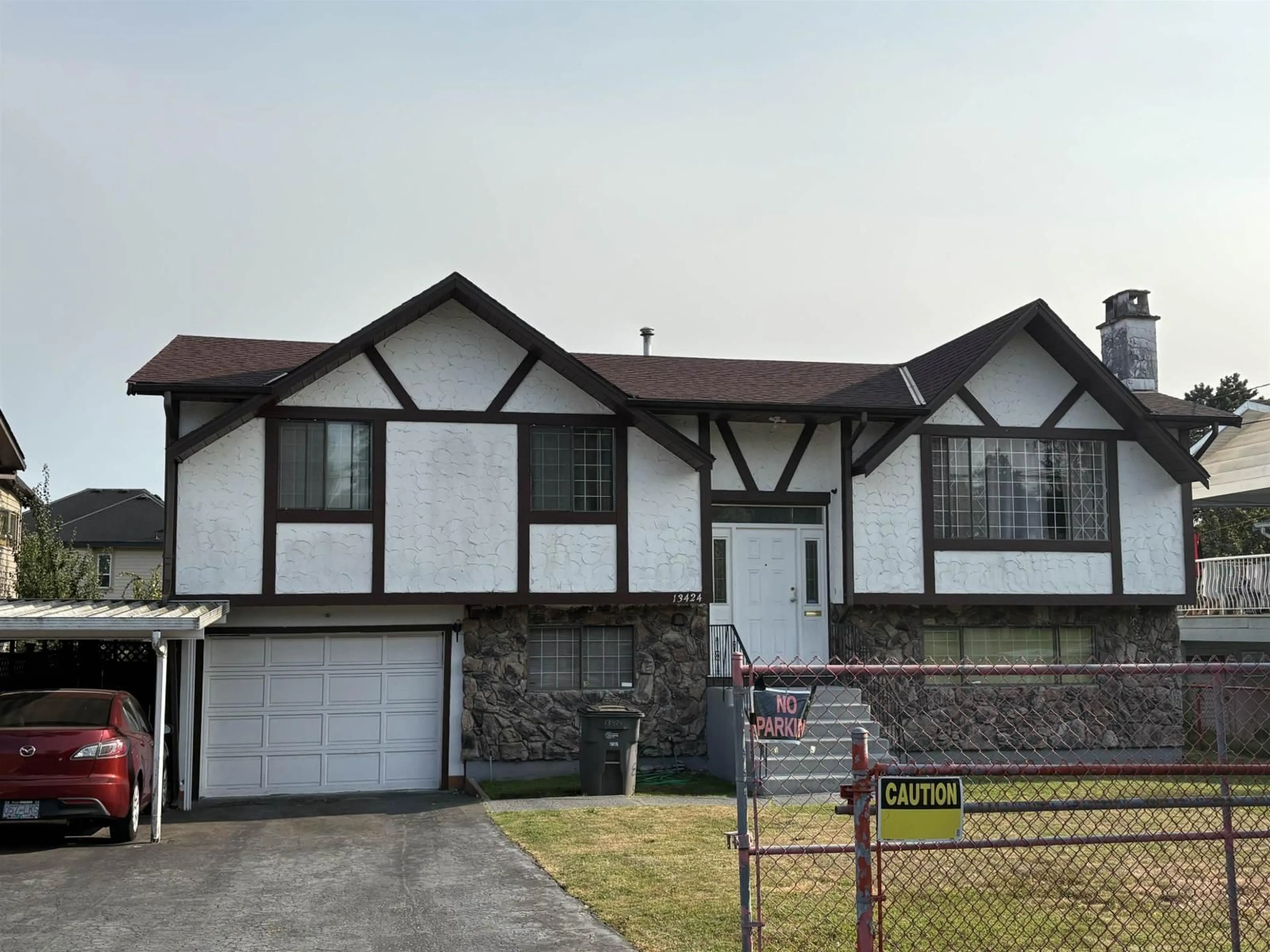 Home with vinyl exterior material, street for 13424 98A, Surrey British Columbia V3T1C8
