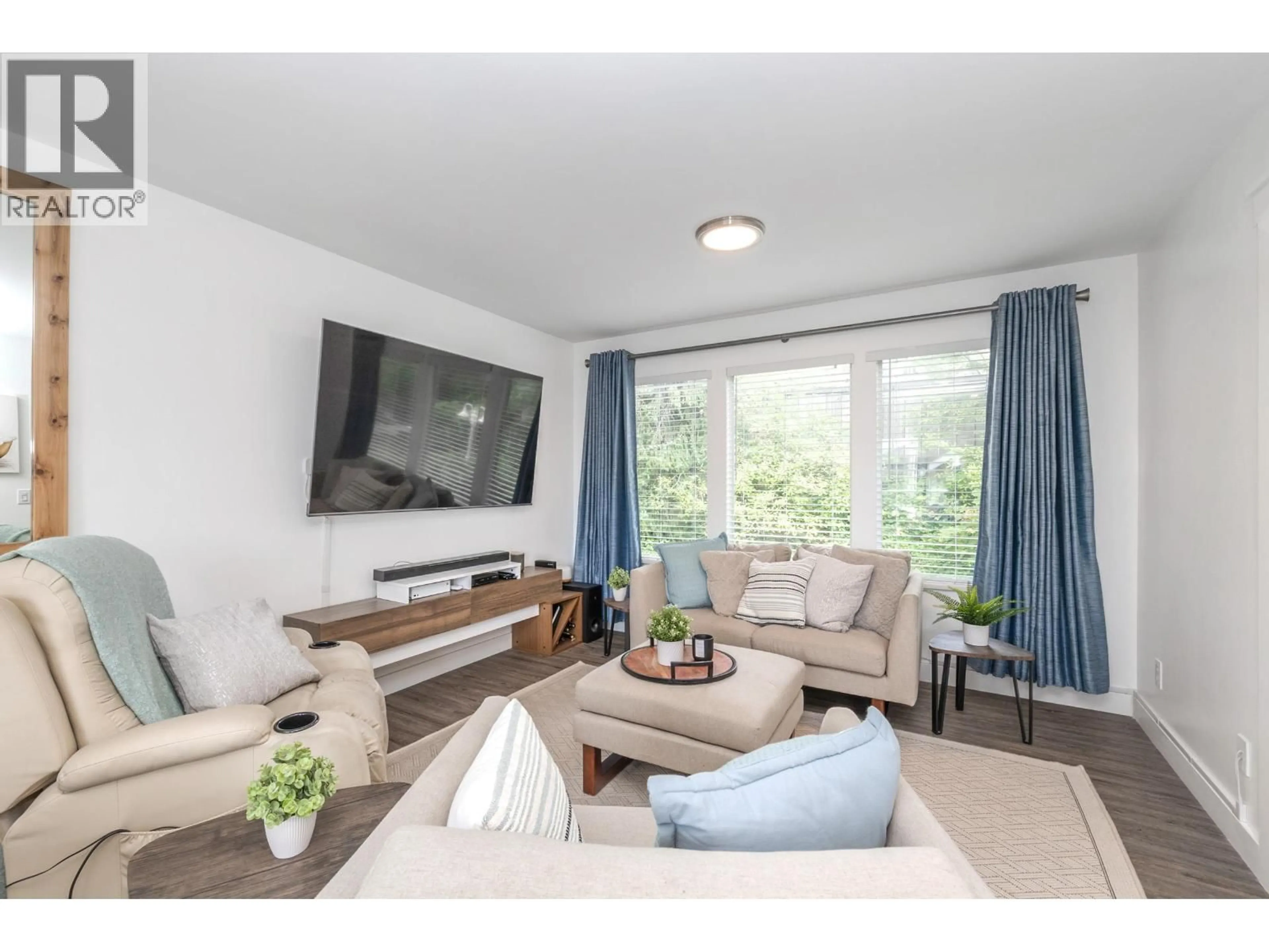 Living room with furniture, wood/laminate floor for 2313 QUAYSIDE COURT, Vancouver British Columbia V5P4W2