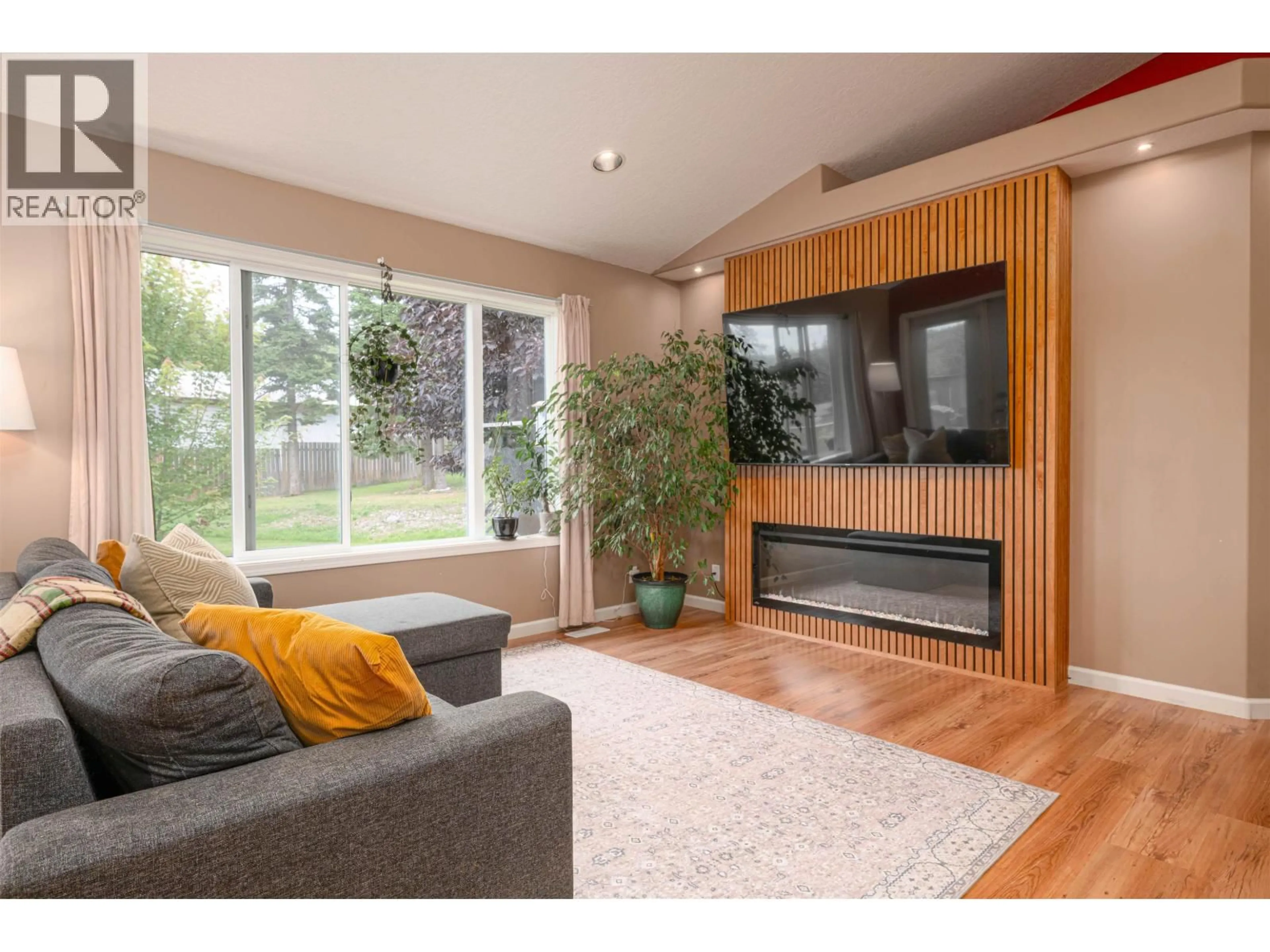 Living room with furniture, wood/laminate floor for 7467 MOOSE ROAD, Prince George British Columbia V2N5N8
