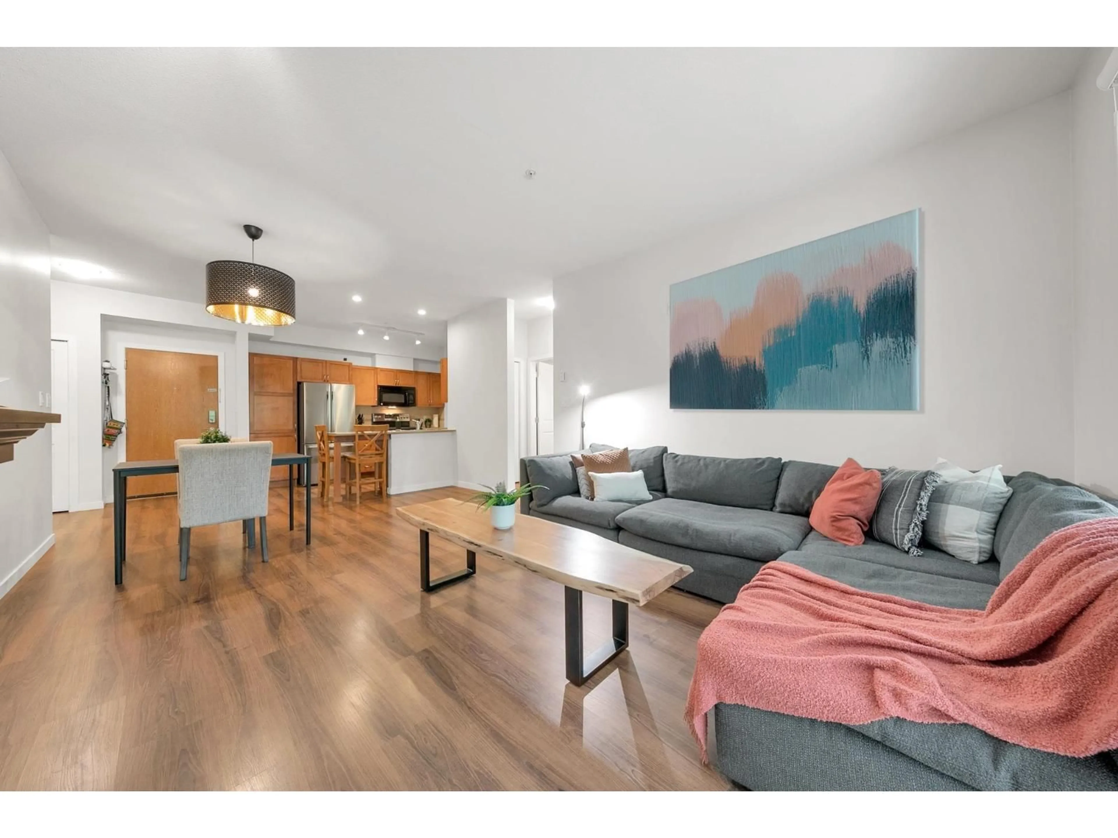 Living room with furniture, wood/laminate floor for 311 - 33318 BOURQUIN EAST, Abbotsford British Columbia V2S0A6