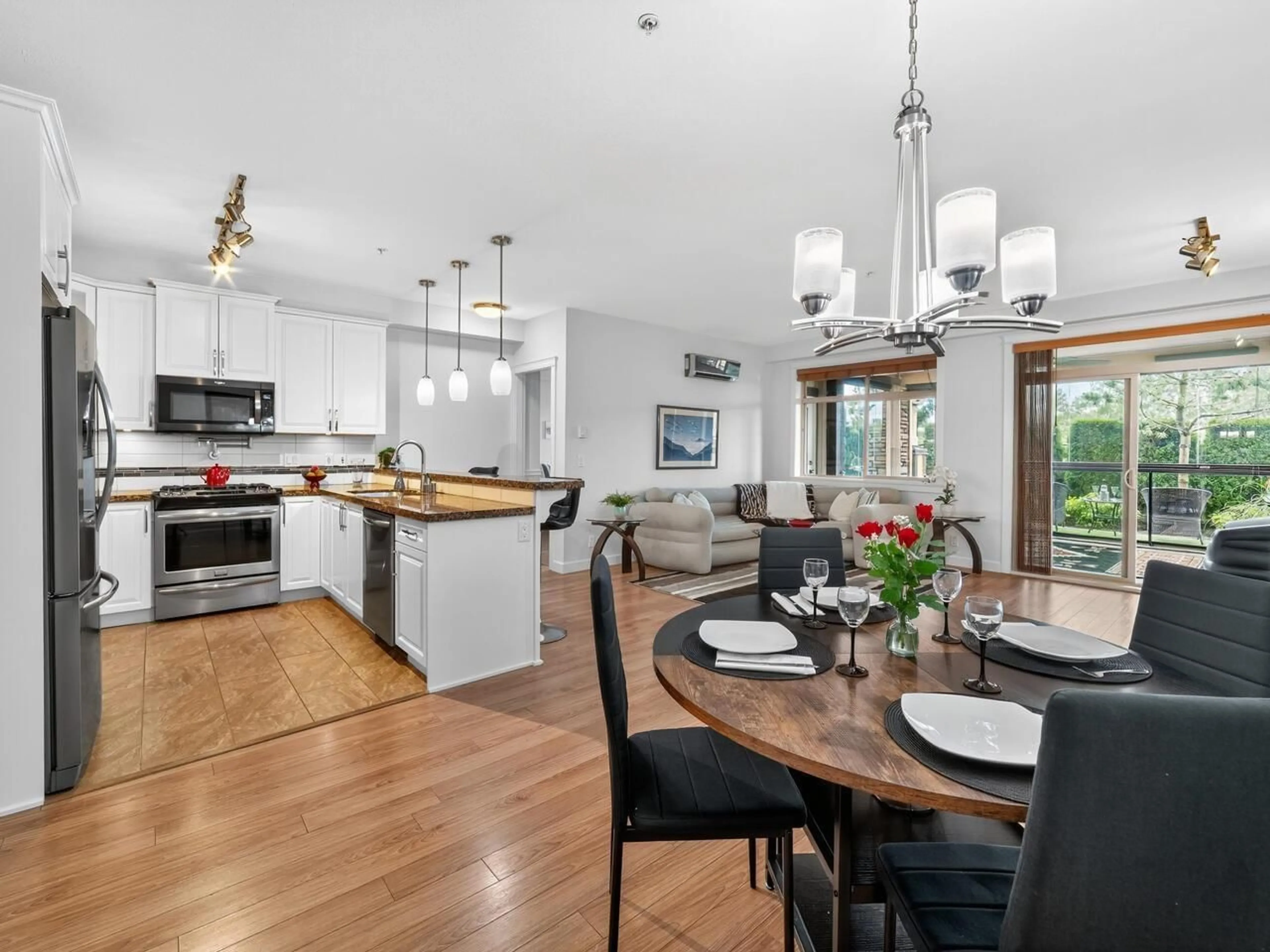 Open concept kitchen, wood/laminate floor for 111 - 8157 207, Langley British Columbia V2Y0V4