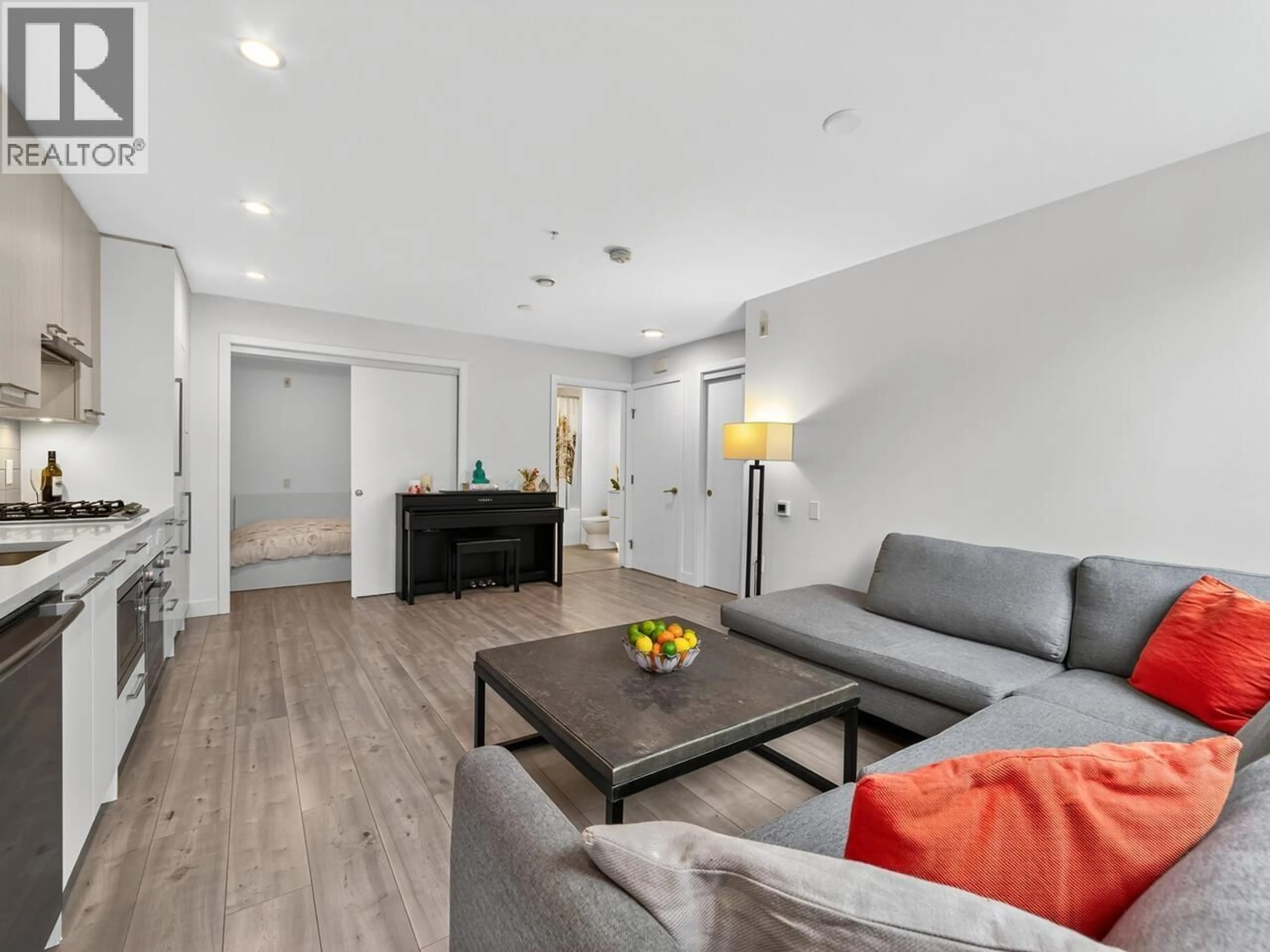 Living room with furniture, wood/laminate floor for 124 - 2035 GLENAIRE DRIVE, North Vancouver British Columbia V7P1Y2
