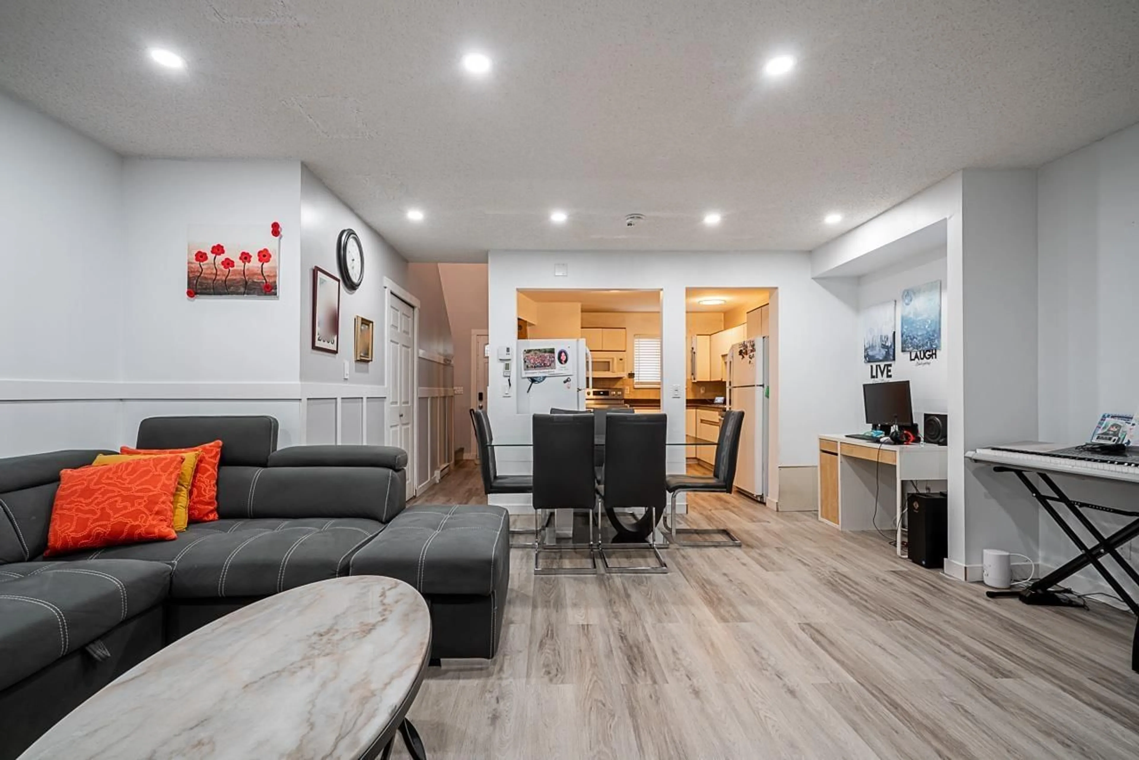 Living room with furniture, wood/laminate floor for 208 - 13632 67, Surrey British Columbia V3W6X5