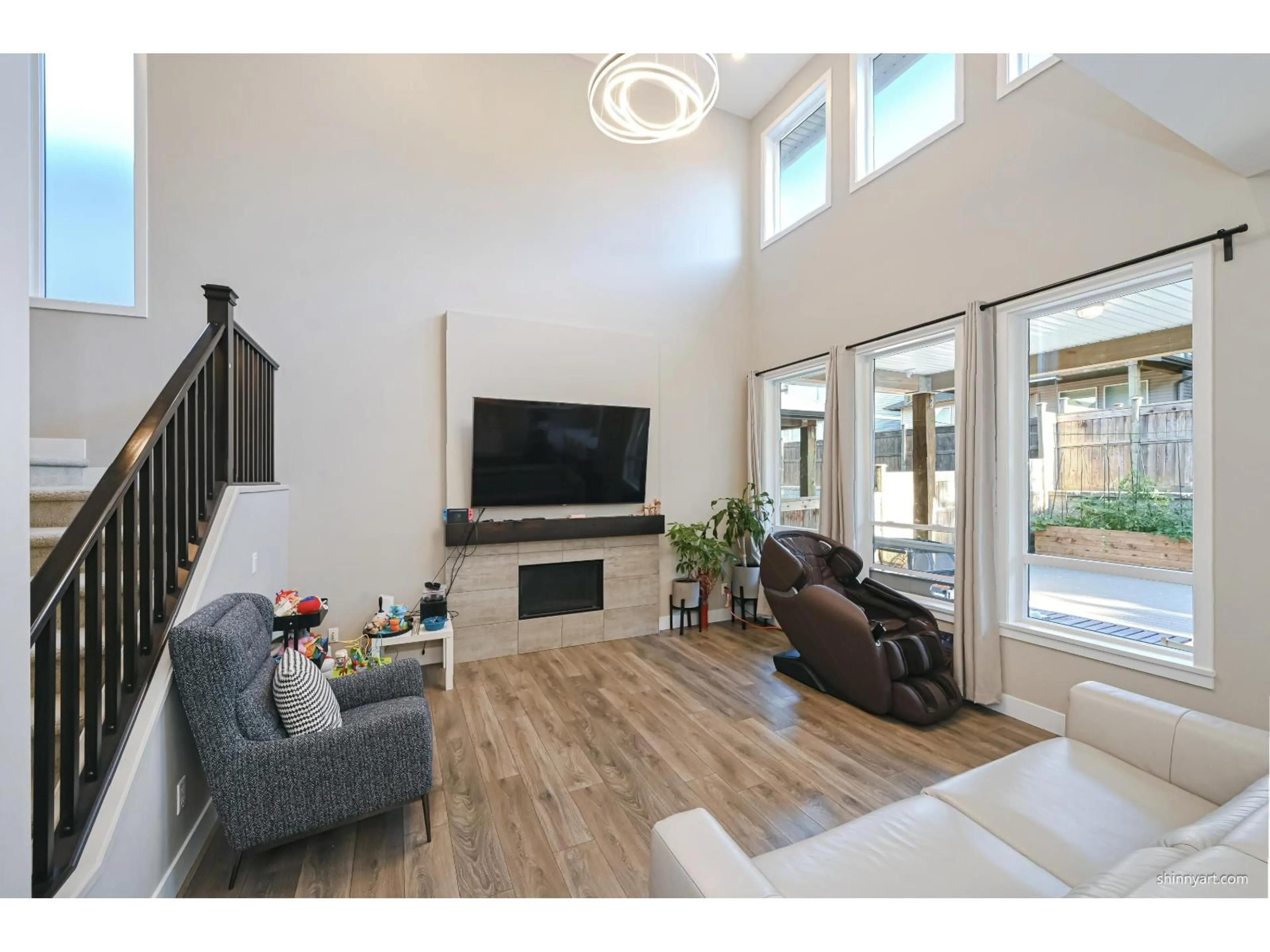 Living room with furniture, wood/laminate floor for 20382 83A, Langley British Columbia V2Y0S2