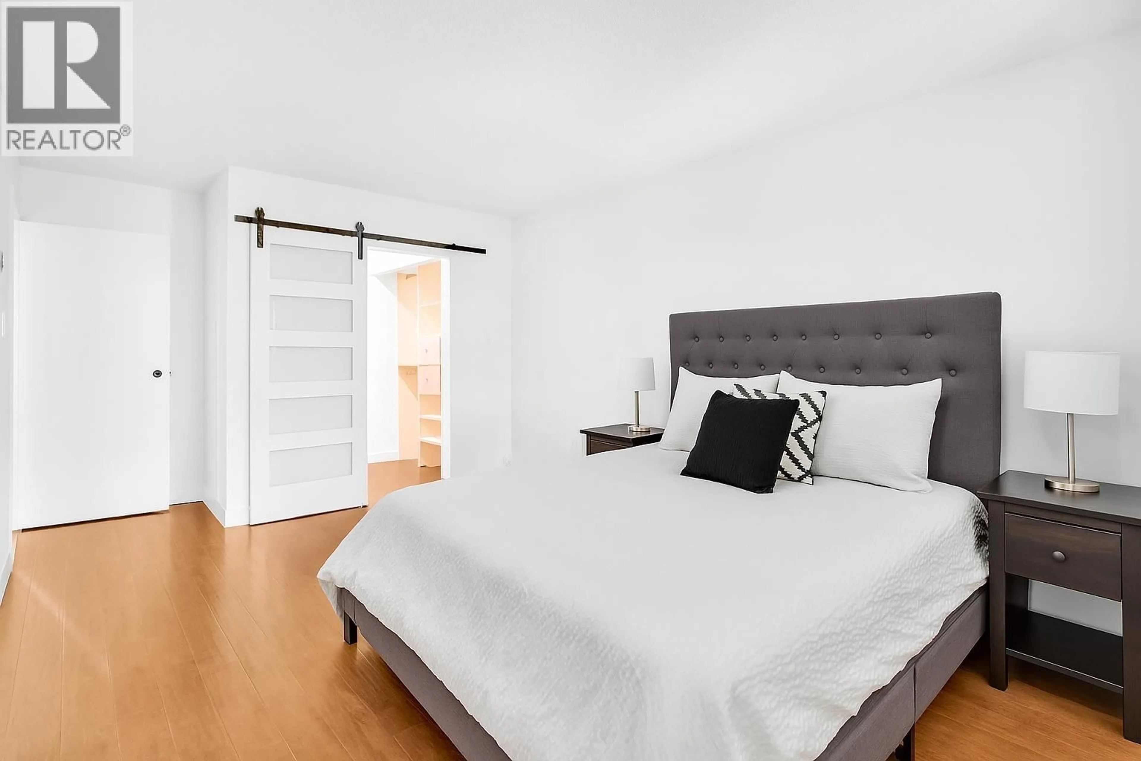 Bedroom with bed, wood/laminate floor for 307 - 2381 BURY AVENUE, Port Coquitlam British Columbia V3C1Z9