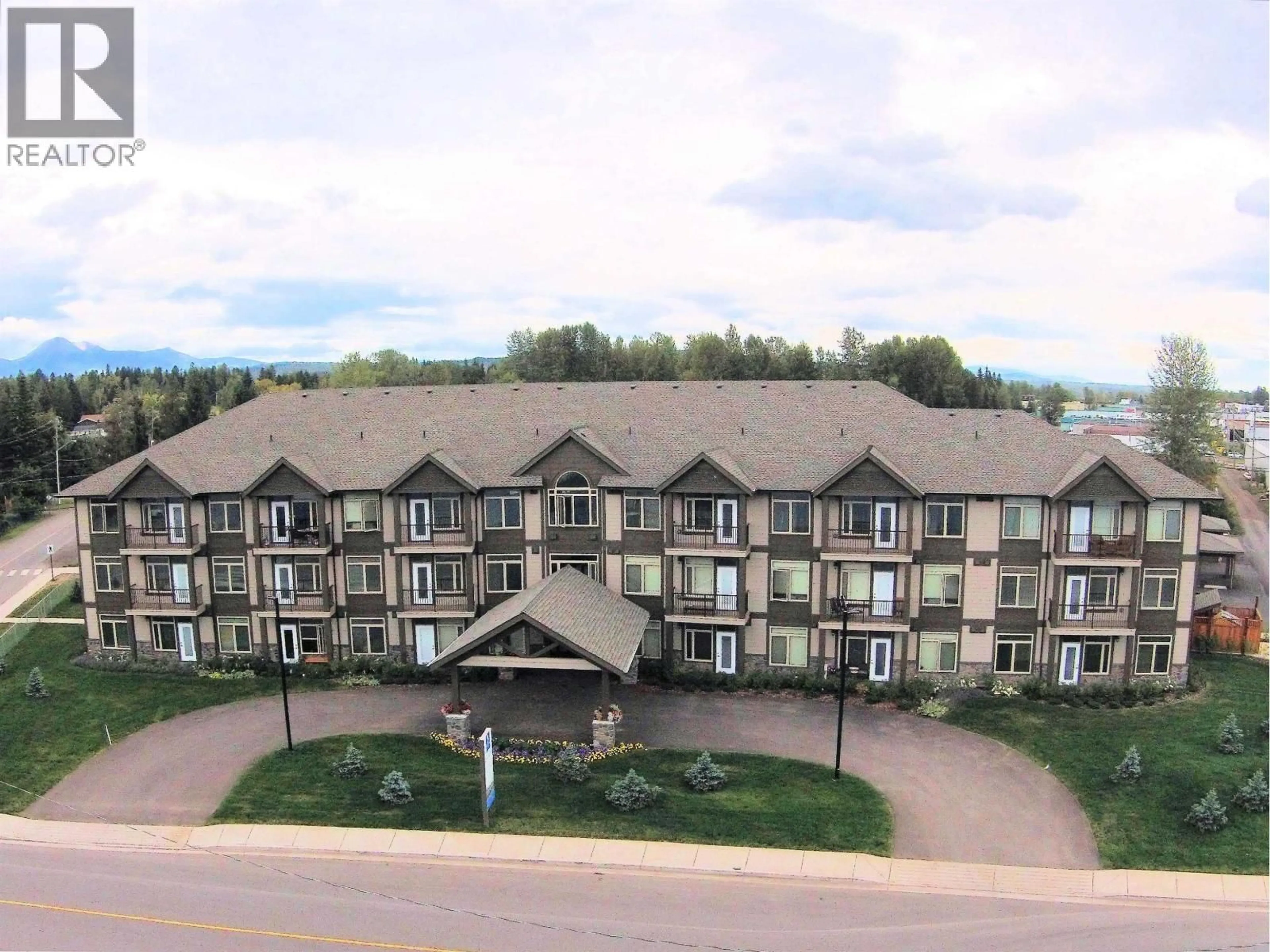 A pic from outside/outdoor area/front of a property/back of a property/a pic from drone, mountain view for 305 - 3684 PRINCESS CRESCENT, Smithers British Columbia V0J2N0