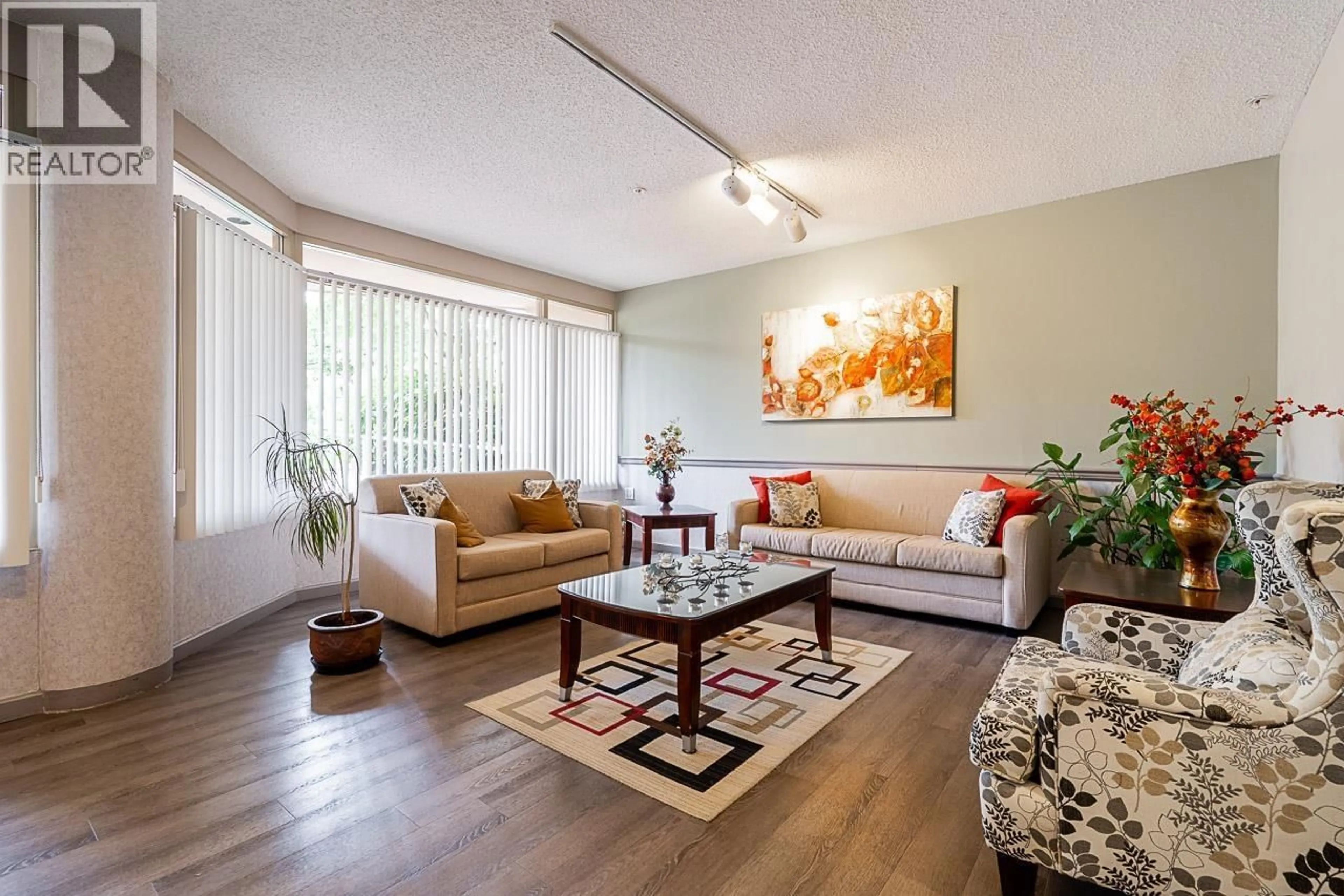 Living room with furniture, wood/laminate floor for 806 - 1190 PIPELINE ROAD, Coquitlam British Columbia V3B7T9