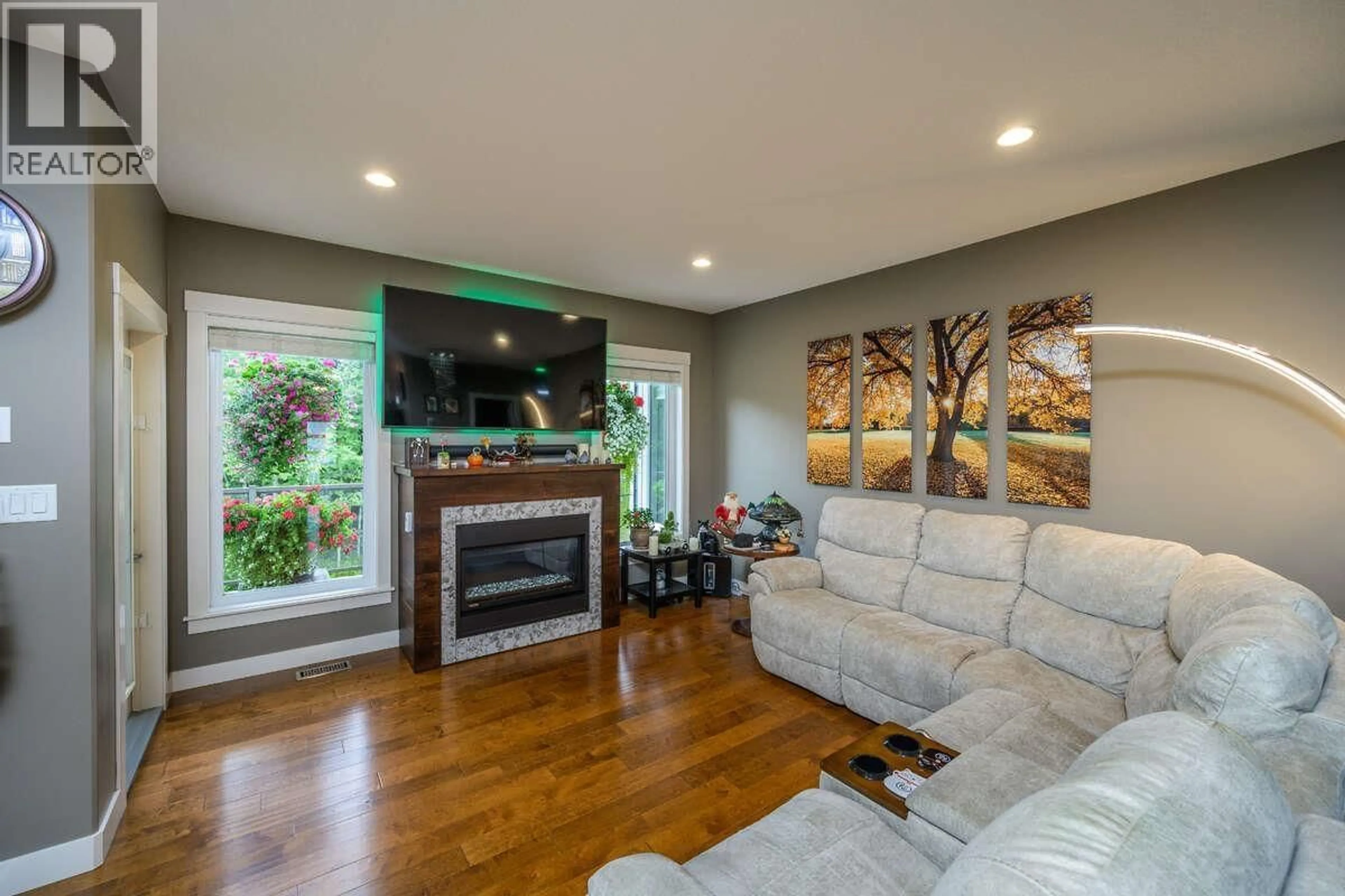 Living room with furniture, wood/laminate floor for 2693 LINKS DRIVE, Prince George British Columbia V2K0A5