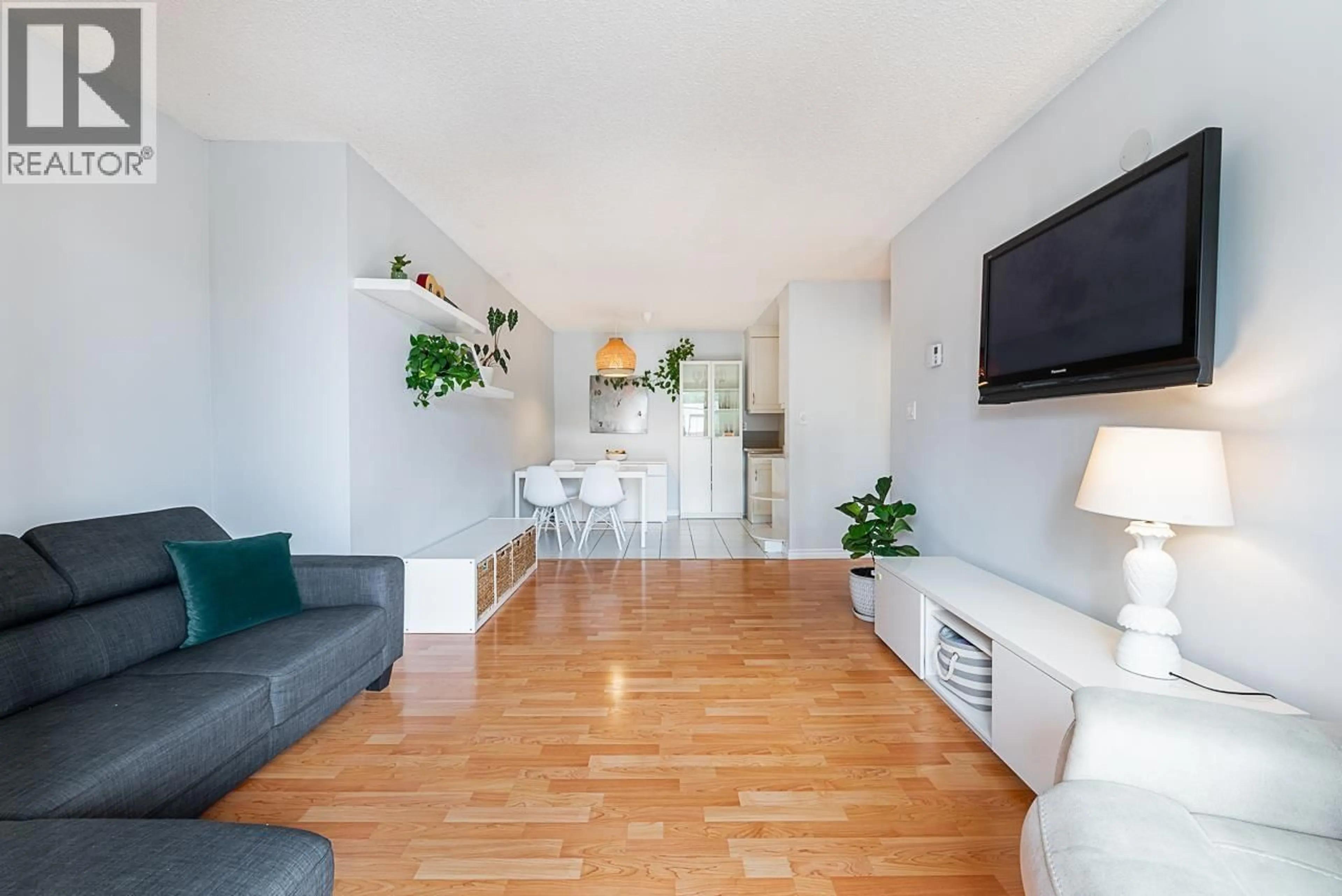 Living room with furniture, wood/laminate floor for 202 - 1103 HOWIE AVENUE, Coquitlam British Columbia V3J1T9