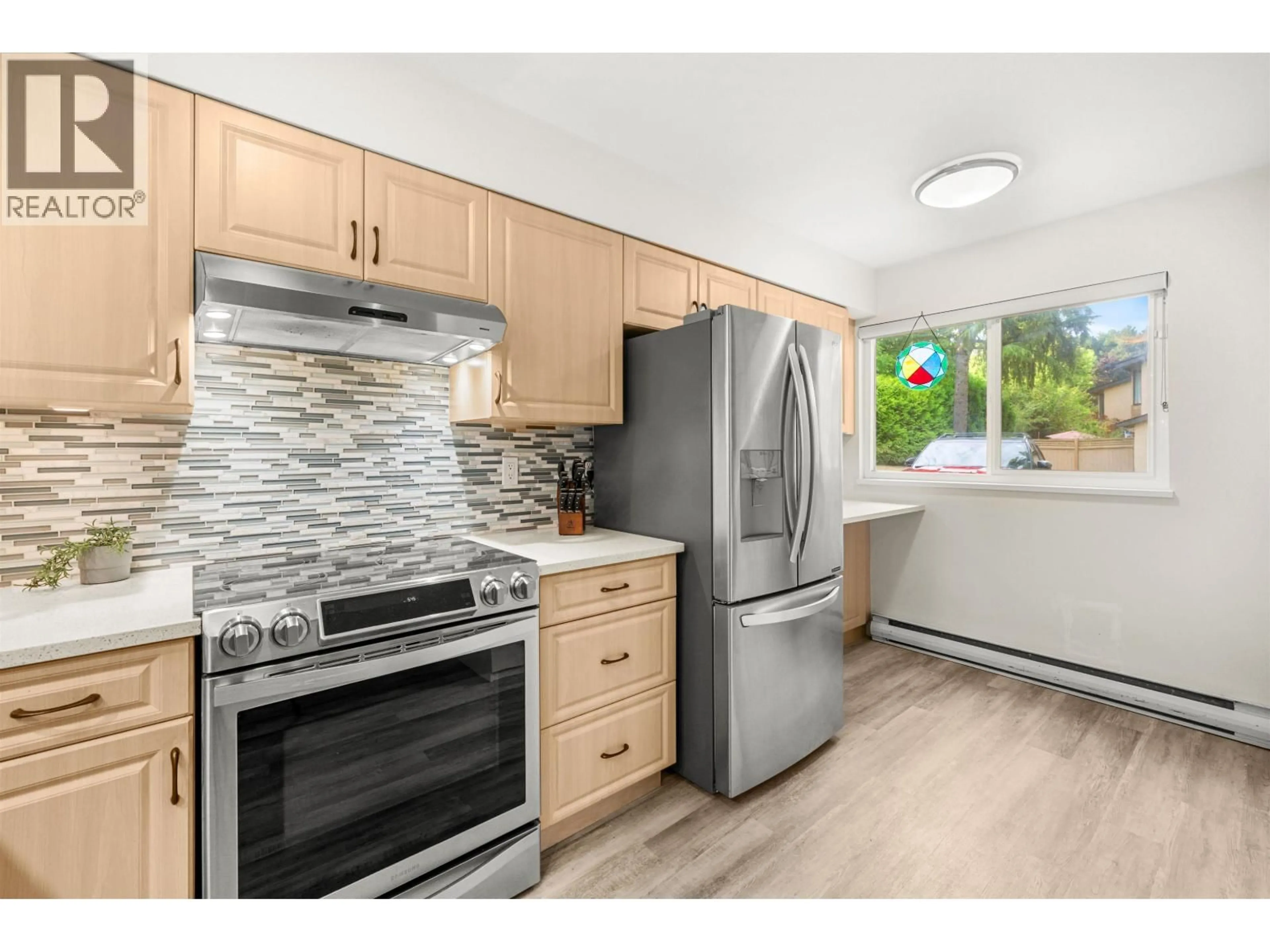 Open concept kitchen, wood/laminate floor for 3 - 6100 TIFFANY BOULEVARD, Richmond British Columbia V7C5A8
