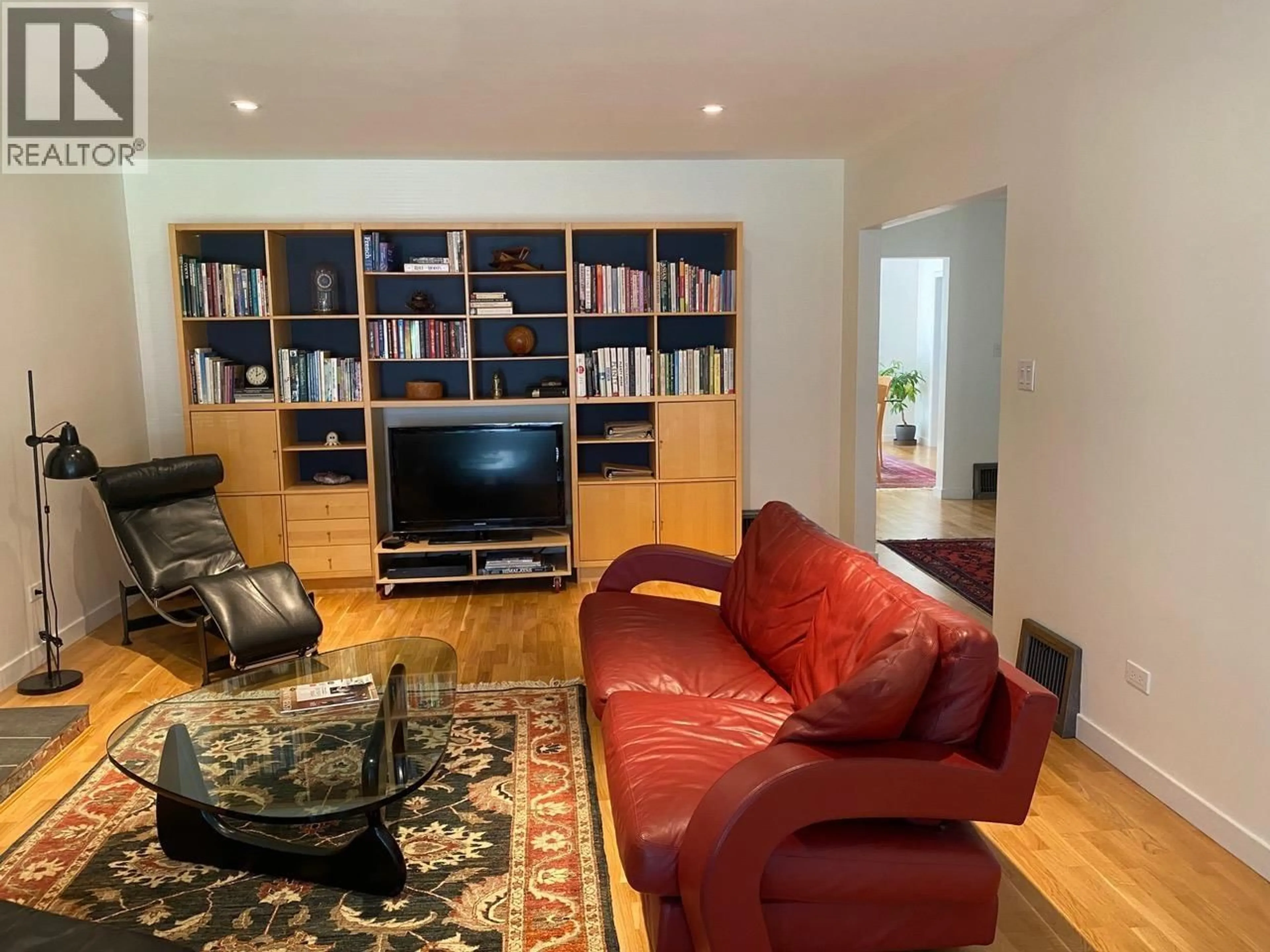 Living room with furniture, wood/laminate floor for 5876 HIGHBURY STREET, Vancouver British Columbia V6N1Z1