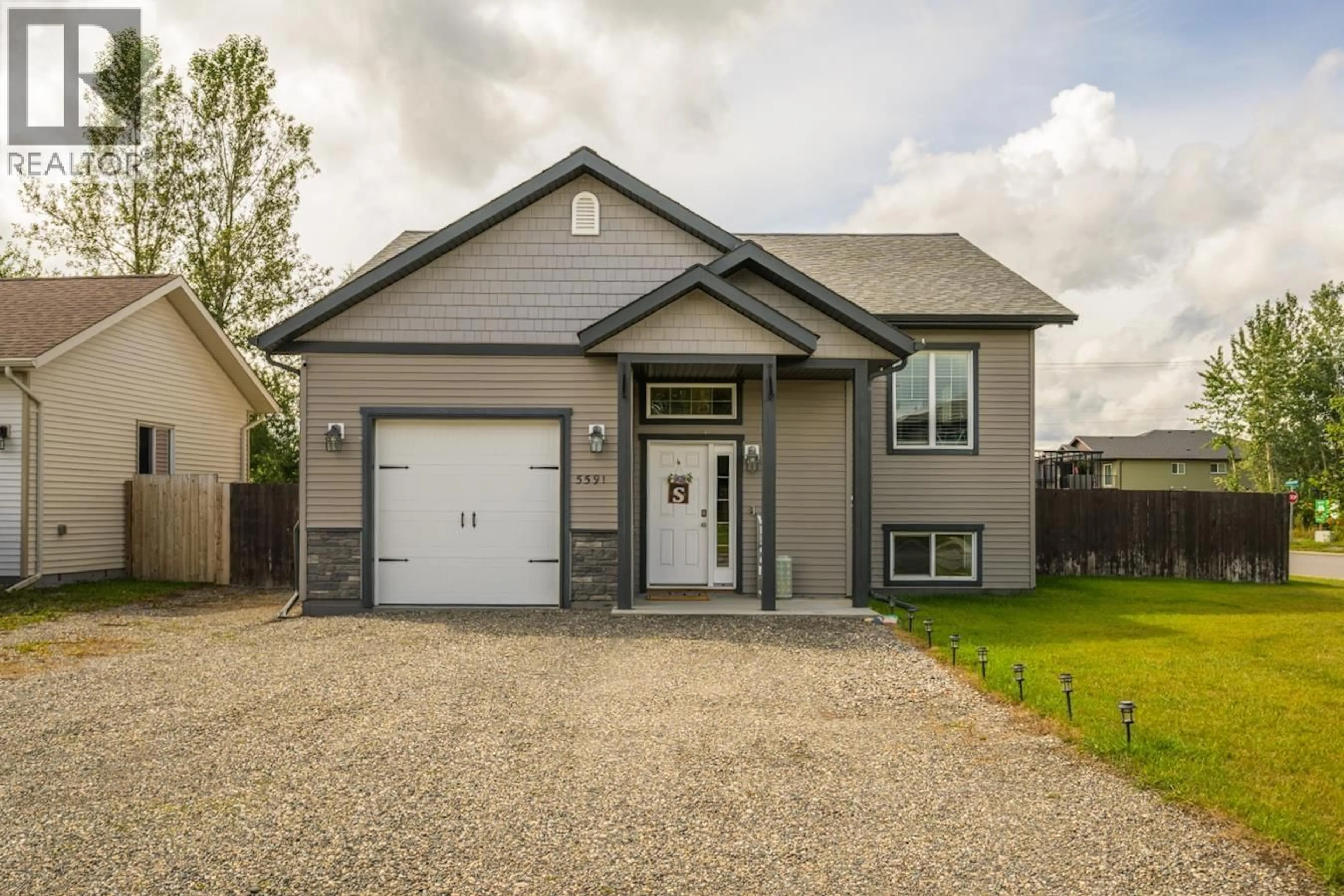 Home with vinyl exterior material, street for 5591 WOODVALLEY DRIVE, Prince George British Columbia V2K5A6
