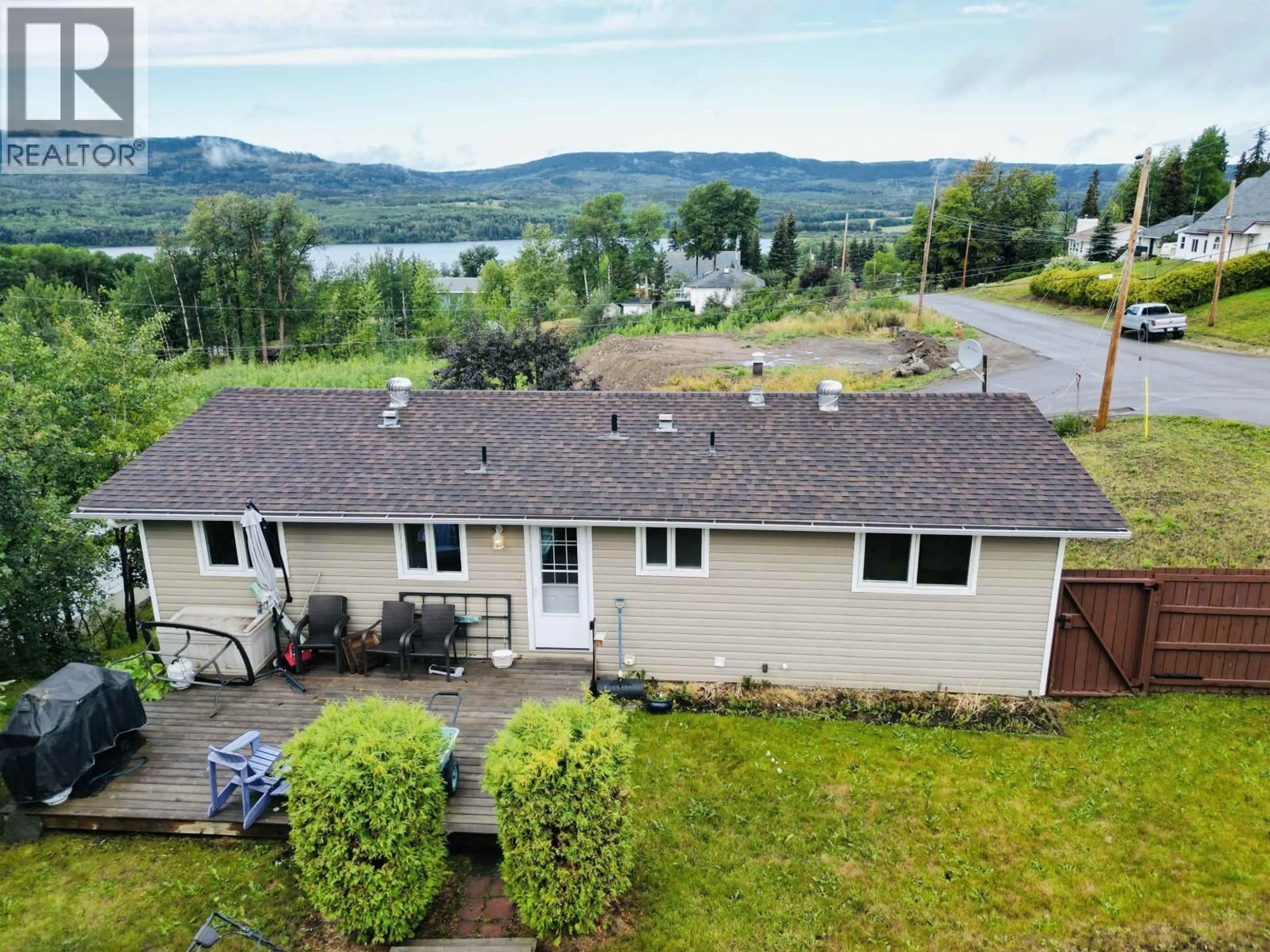 A pic from outside/outdoor area/front of a property/back of a property/a pic from drone, water/lake/river/ocean view for 416 CARROLL STREET, Burns Lake British Columbia V0J1E0