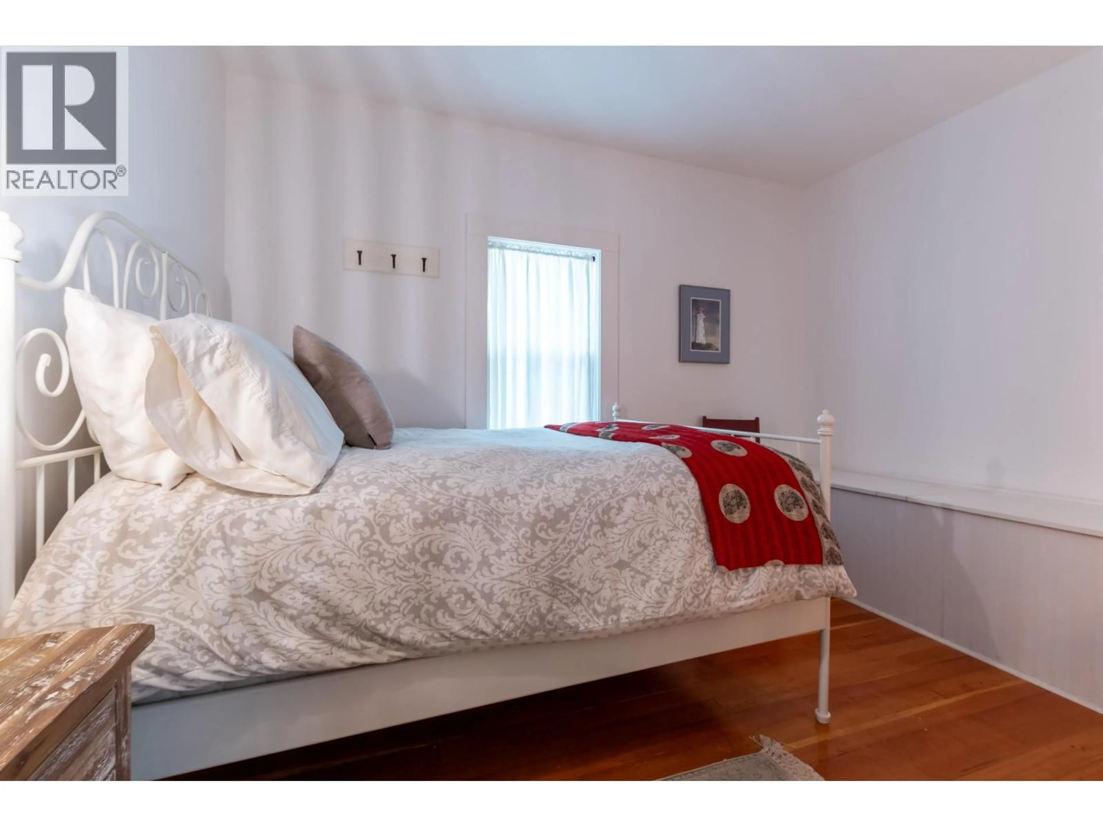 Bedroom with bed, wood/laminate floor for 384 BURDEN STREET, Prince George British Columbia V2M2H3