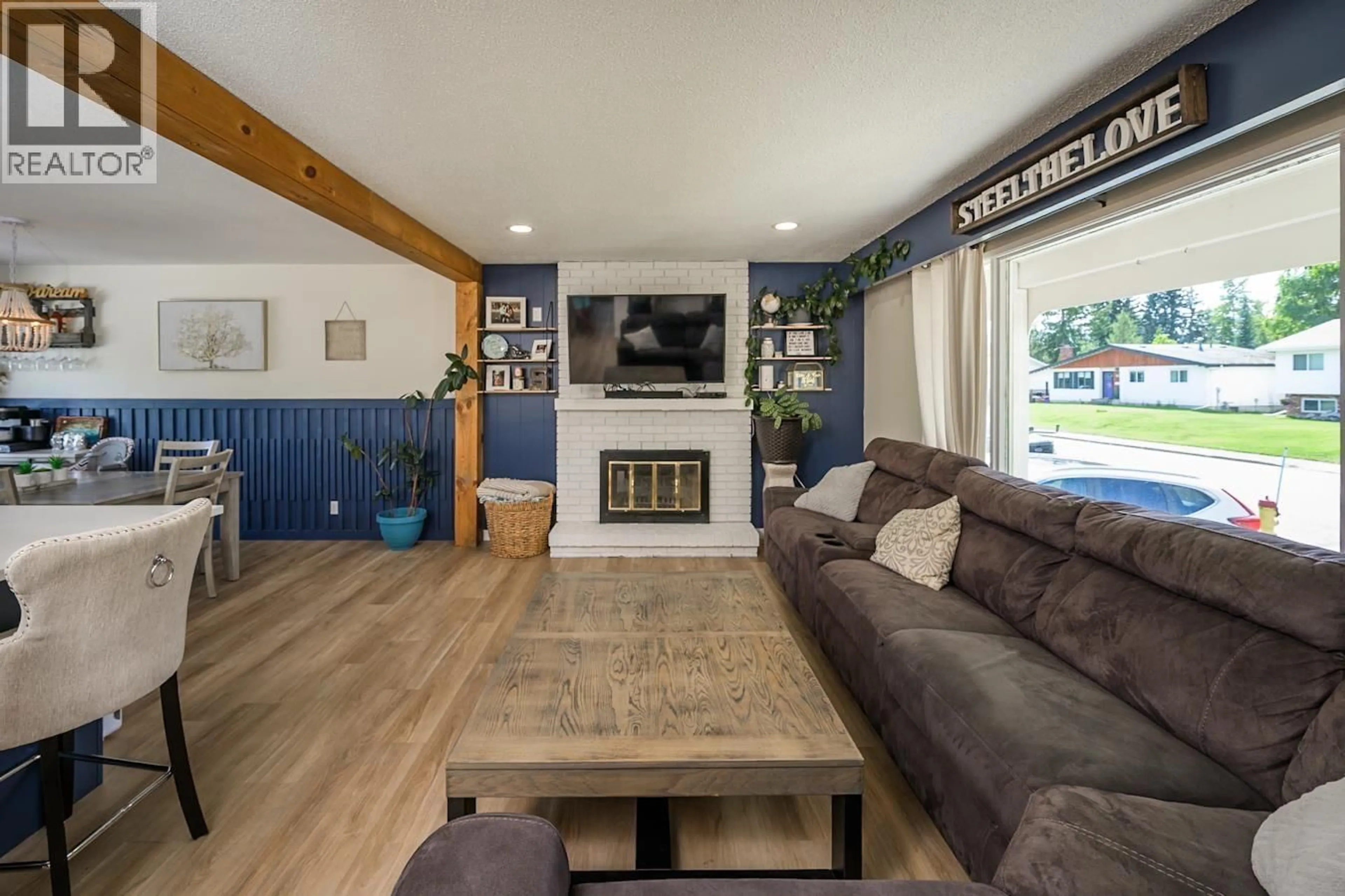 Living room with furniture, wood/laminate floor for 192 MCDERMID DRIVE, Prince George British Columbia V2M4V1