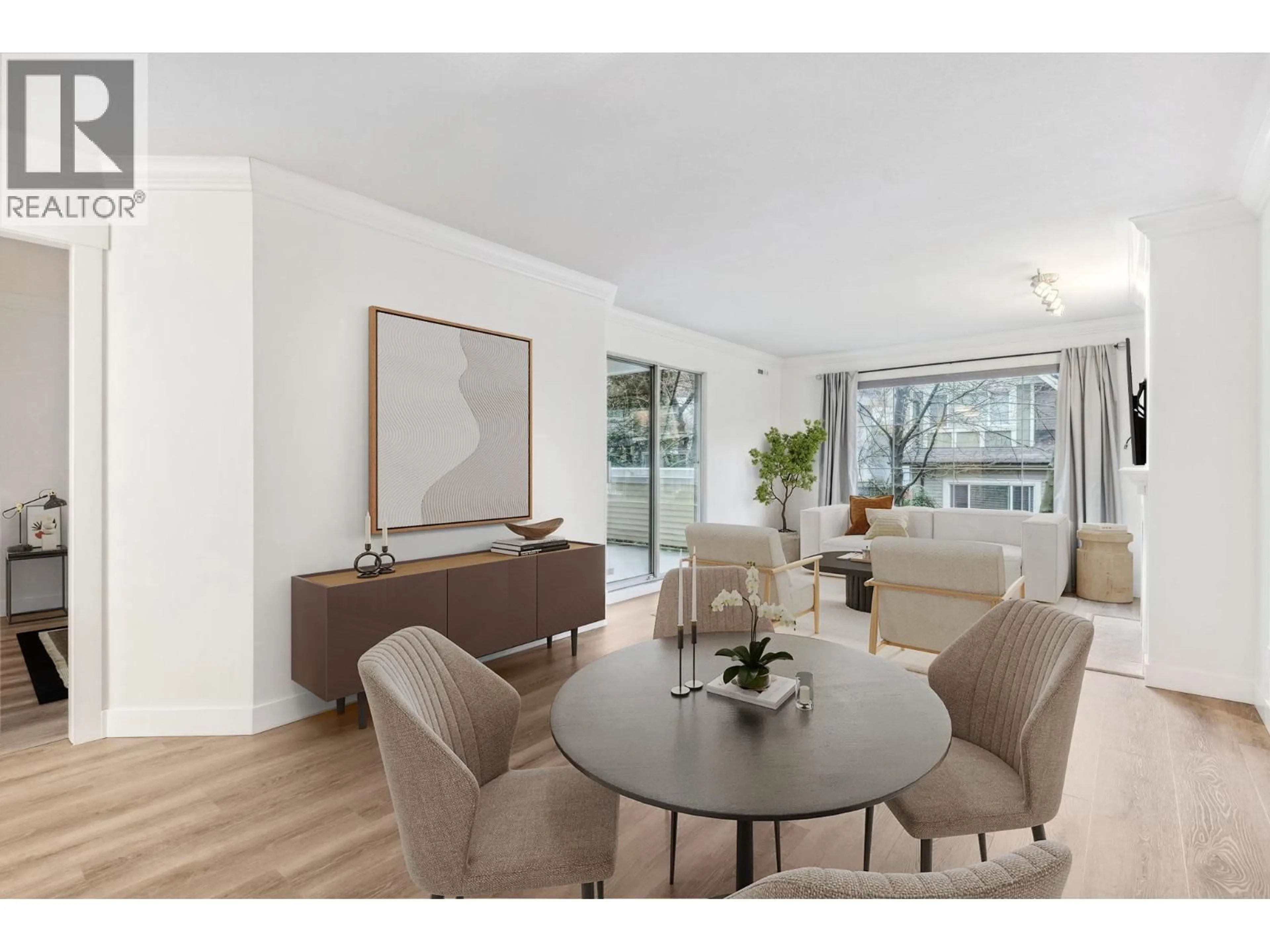 Living room with furniture, wood/laminate floor for 212 - 6820 RUMBLE STREET, Burnaby British Columbia V5E4H9