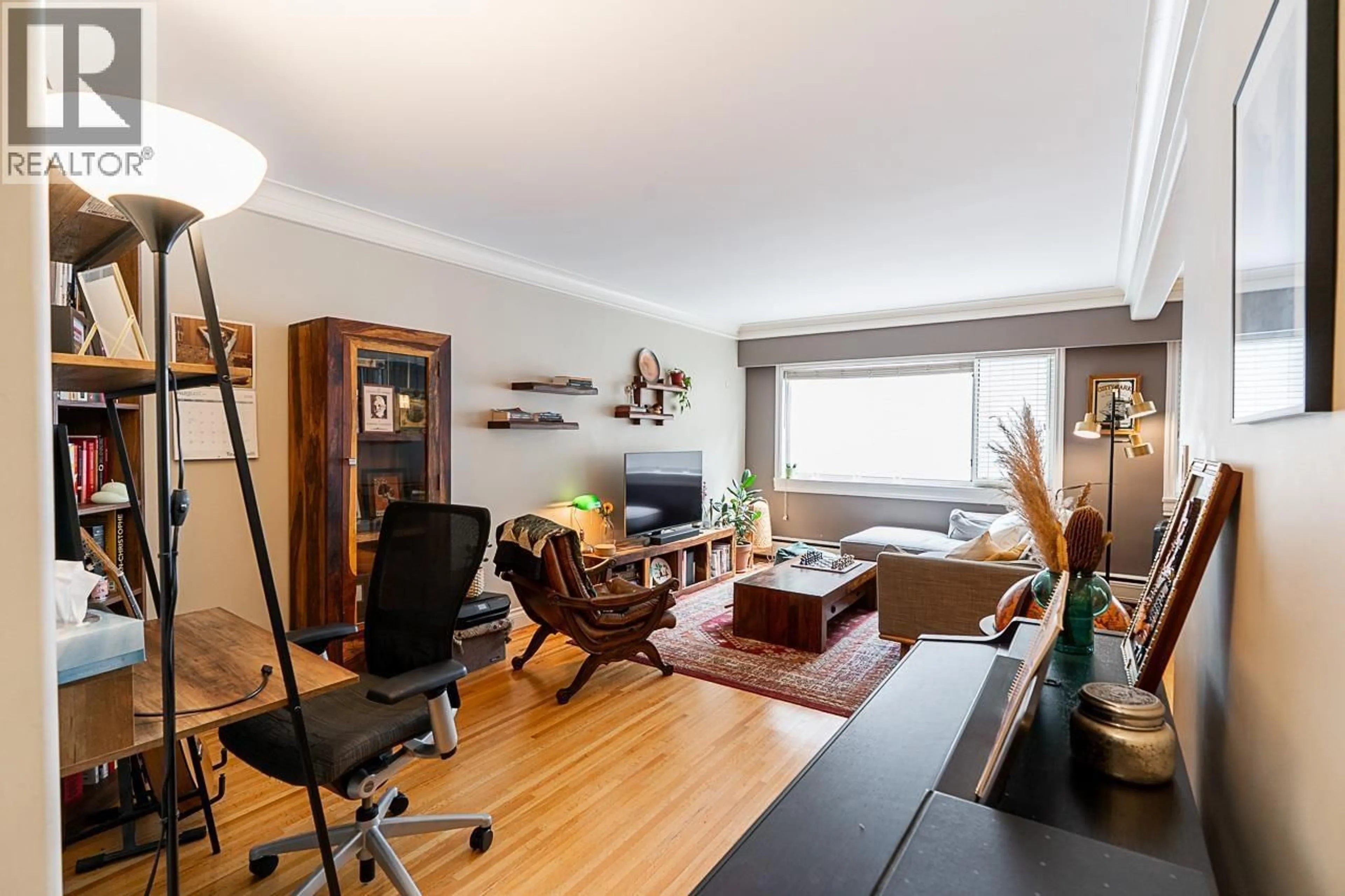 Living room with furniture, wood/laminate floor for 208 - 2493 1ST AVENUE, Vancouver British Columbia V6K1G5
