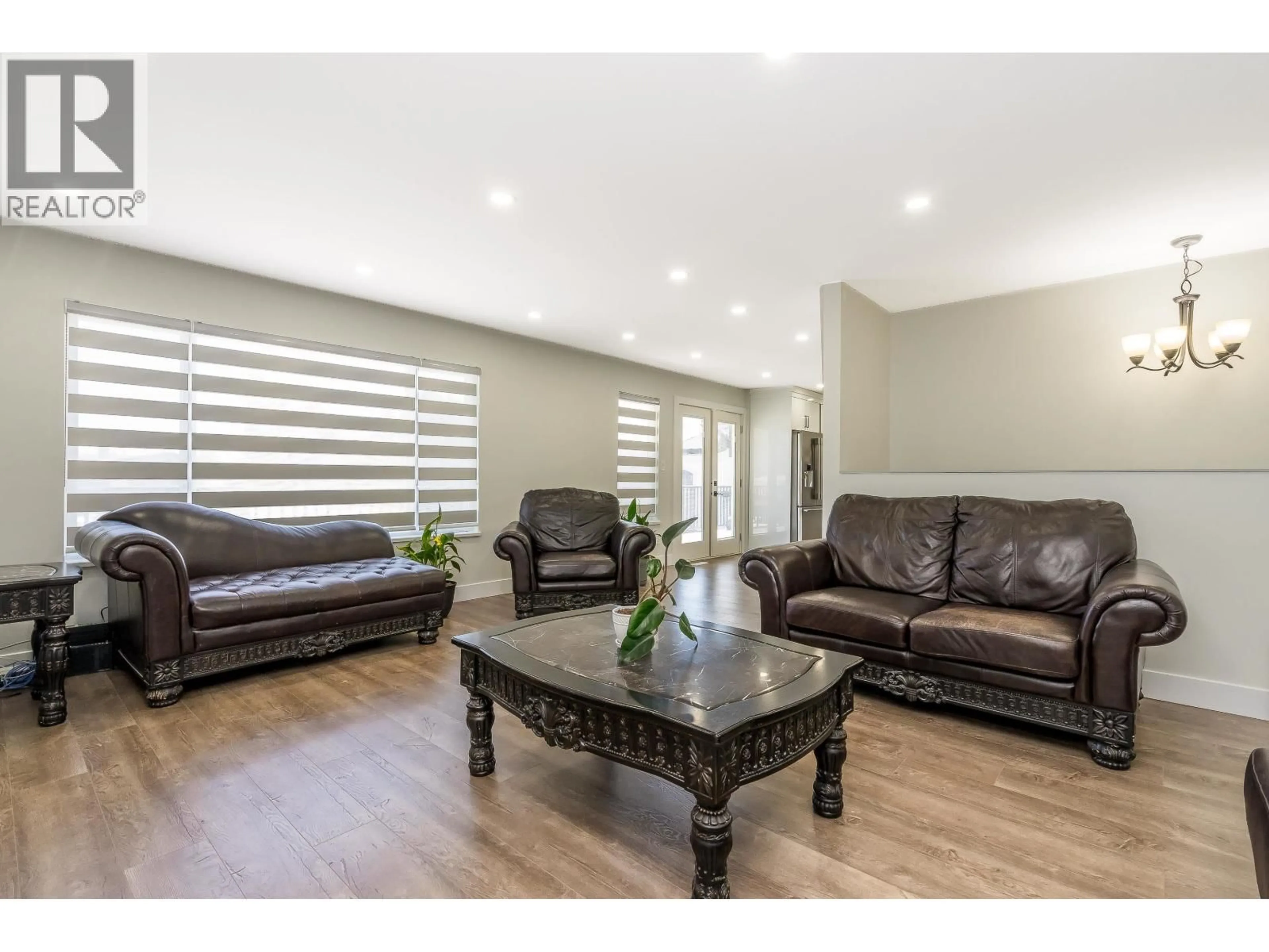 Living room with furniture, wood/laminate floor for 7331 LOMBARD ROAD, Richmond British Columbia V7C3M9