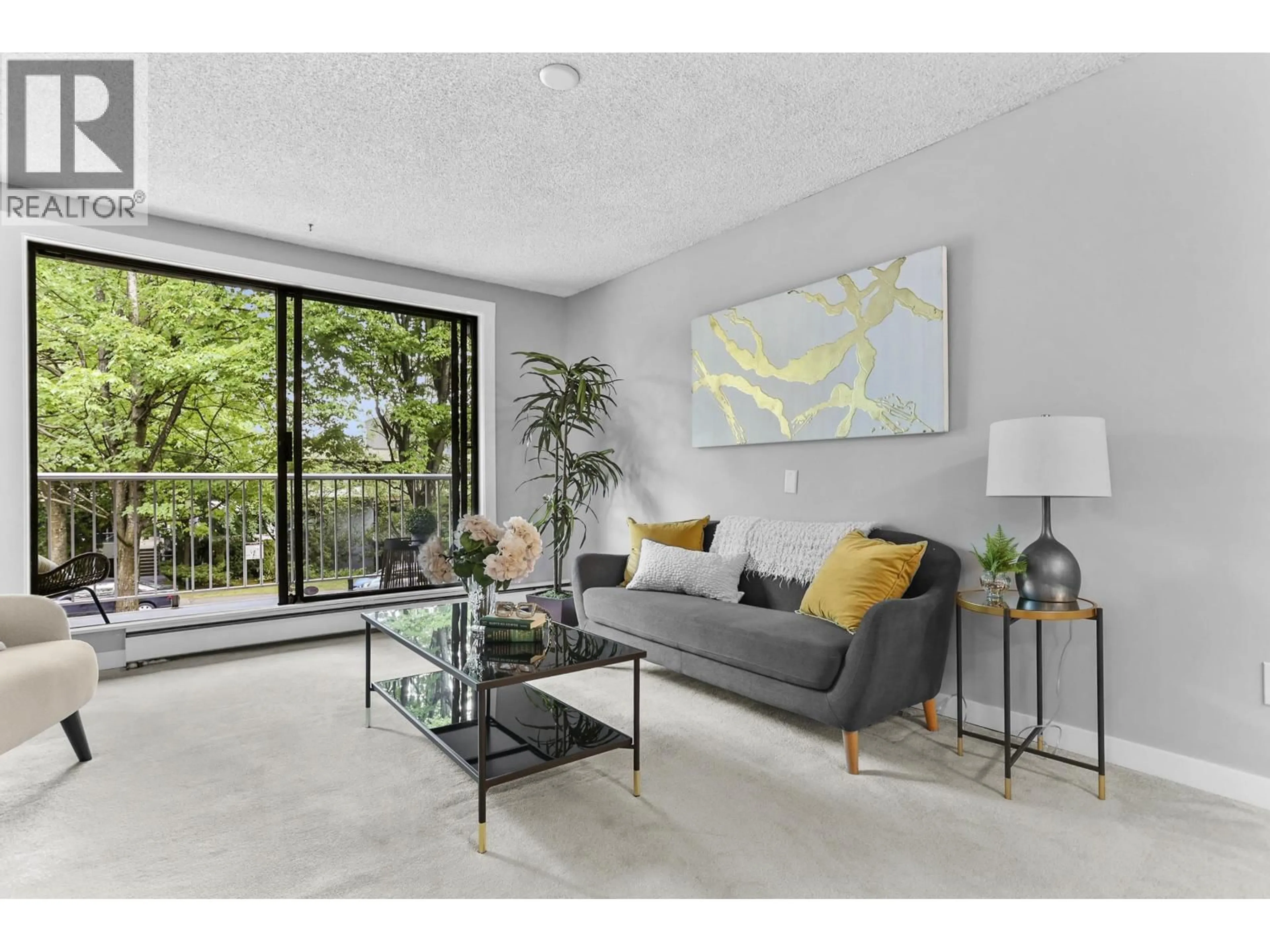Living room with furniture, unknown for 214 - 3921 CARRIGAN COURT, Burnaby British Columbia V3N4J7
