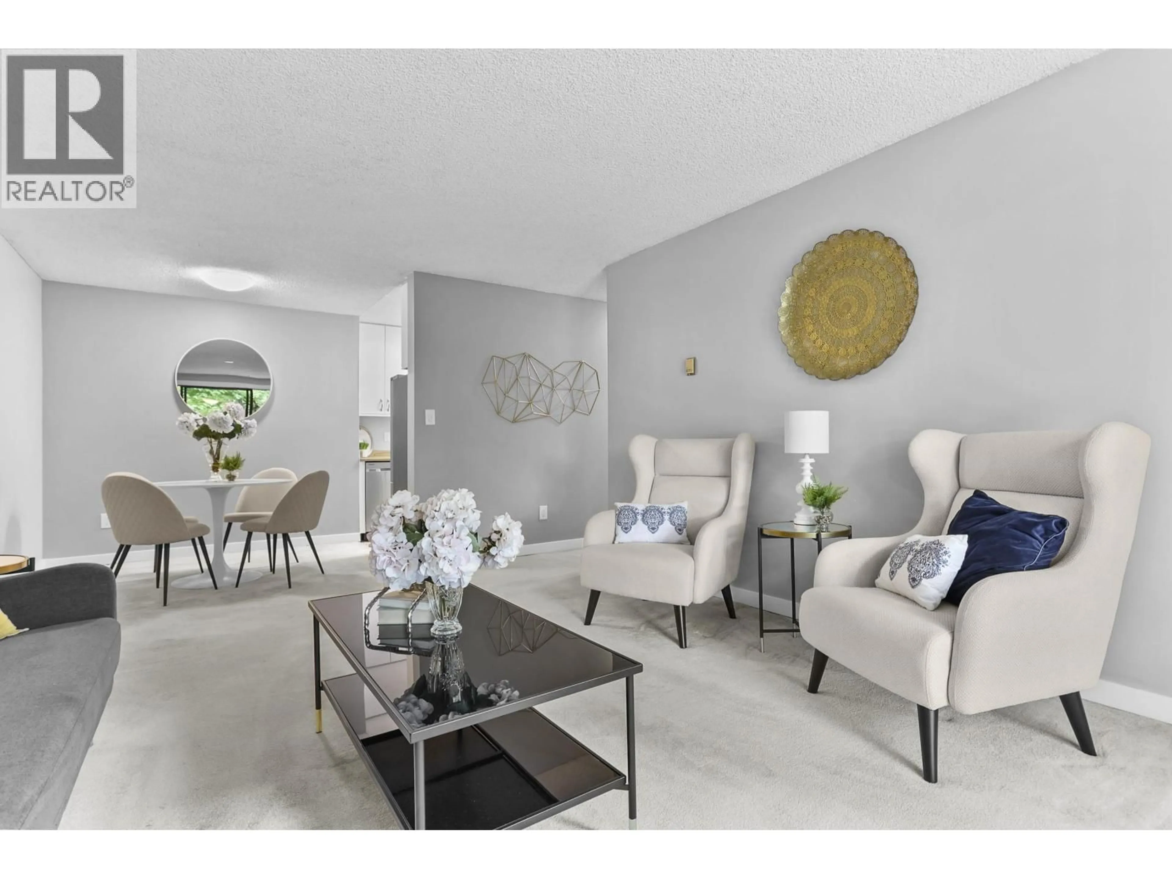 Living room with furniture, unknown for 214 - 3921 CARRIGAN COURT, Burnaby British Columbia V3N4J7