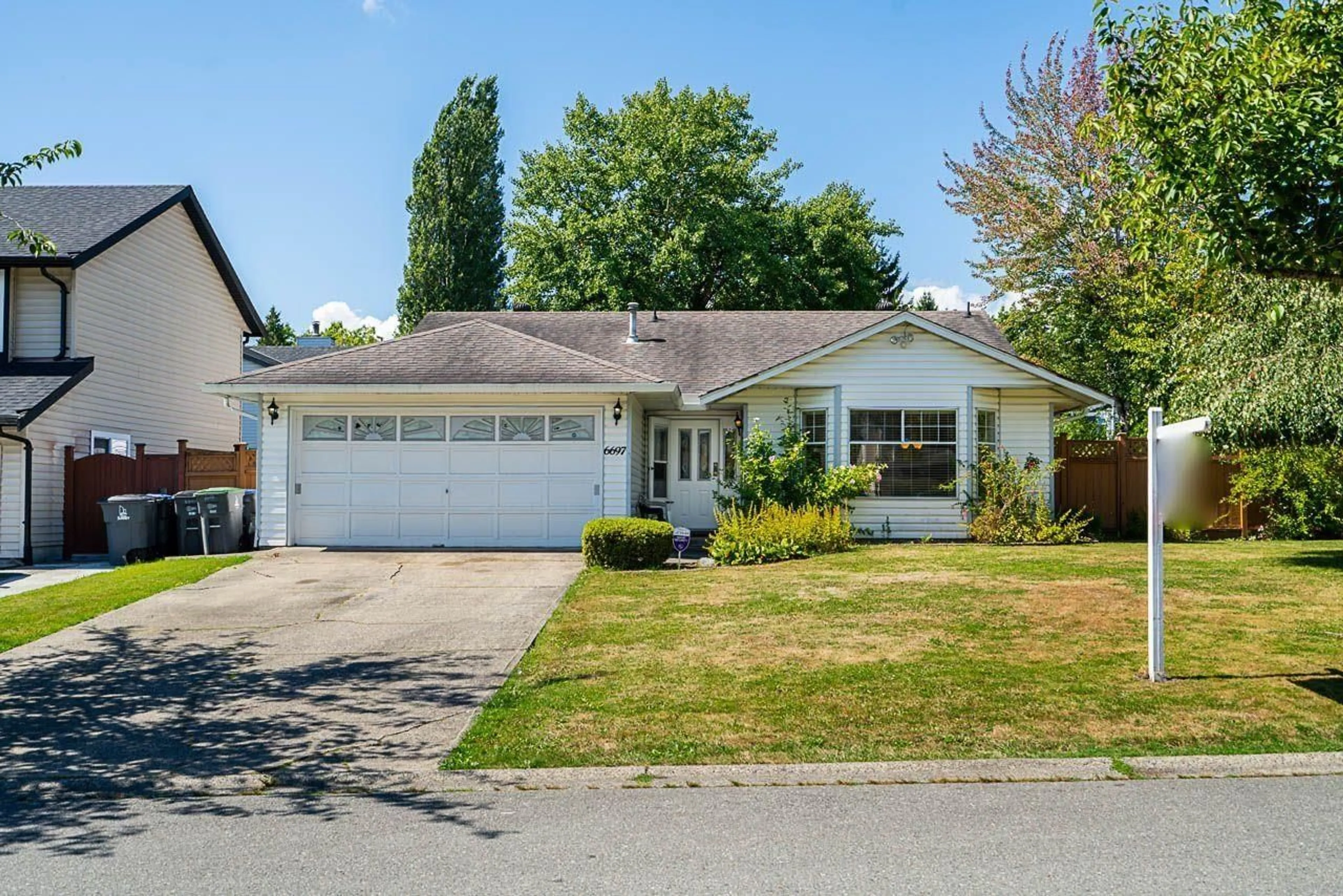Home with vinyl exterior material, street for 6697 141A, Surrey British Columbia V3W9N8