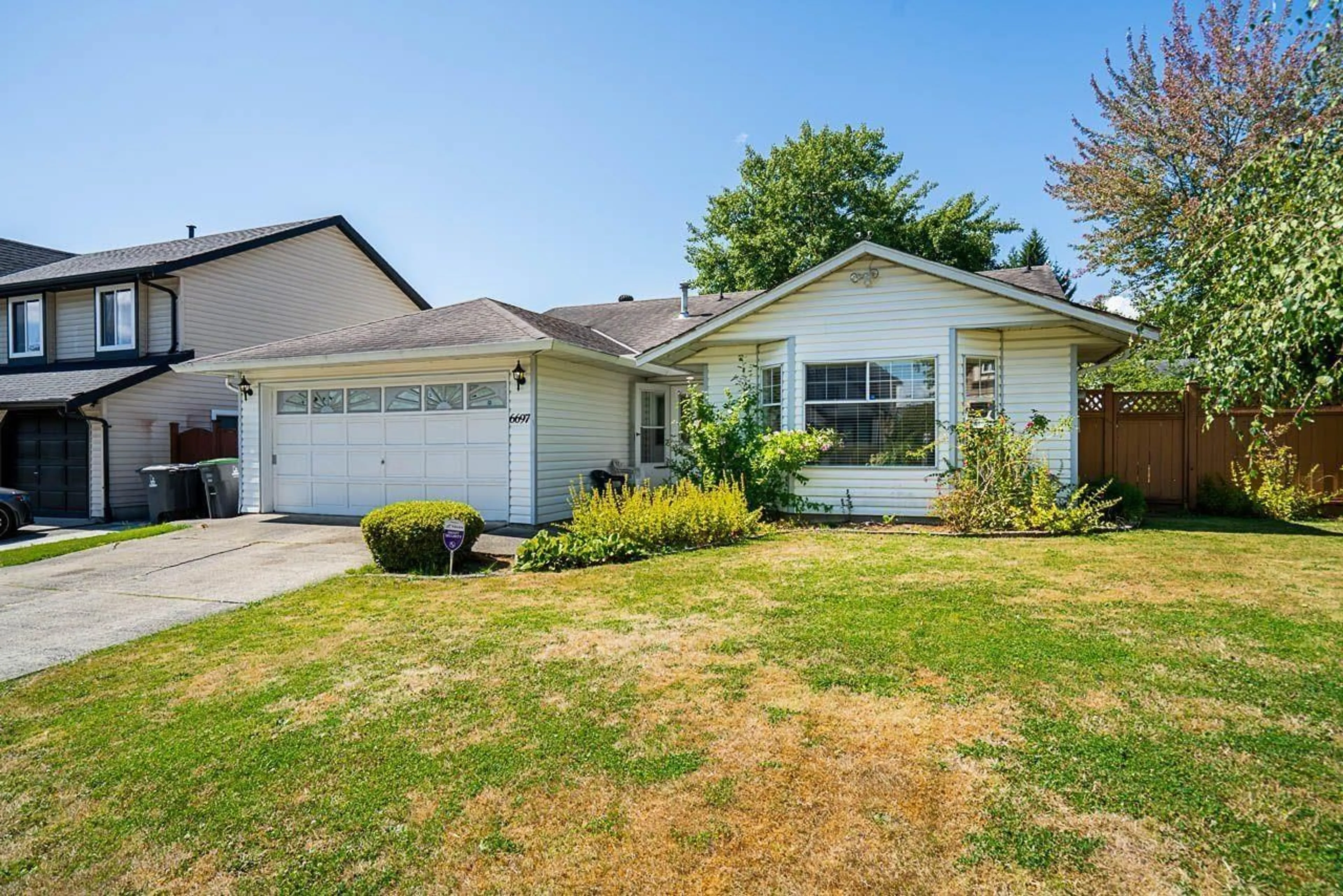 Home with vinyl exterior material, street for 6697 141A, Surrey British Columbia V3W9N8