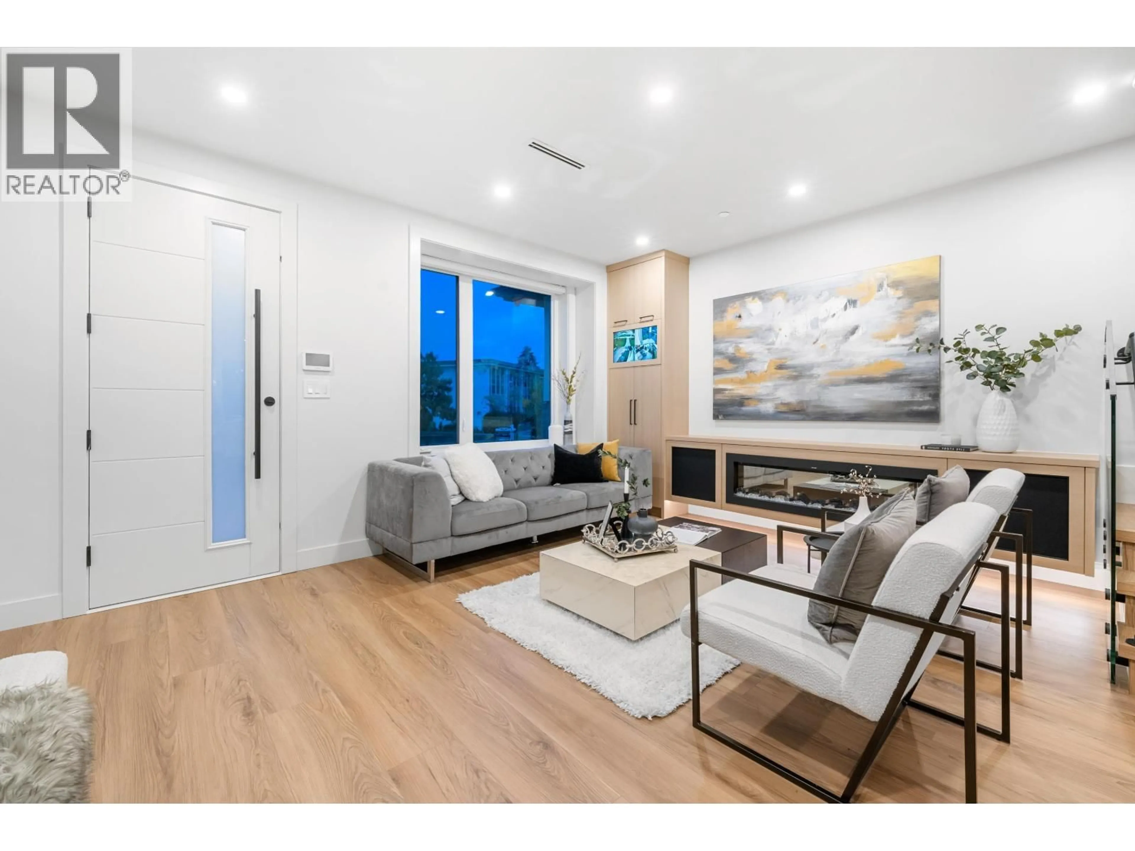 Living room with furniture, wood/laminate floor for 1810 55TH AVENUE, Vancouver British Columbia V5P2A1