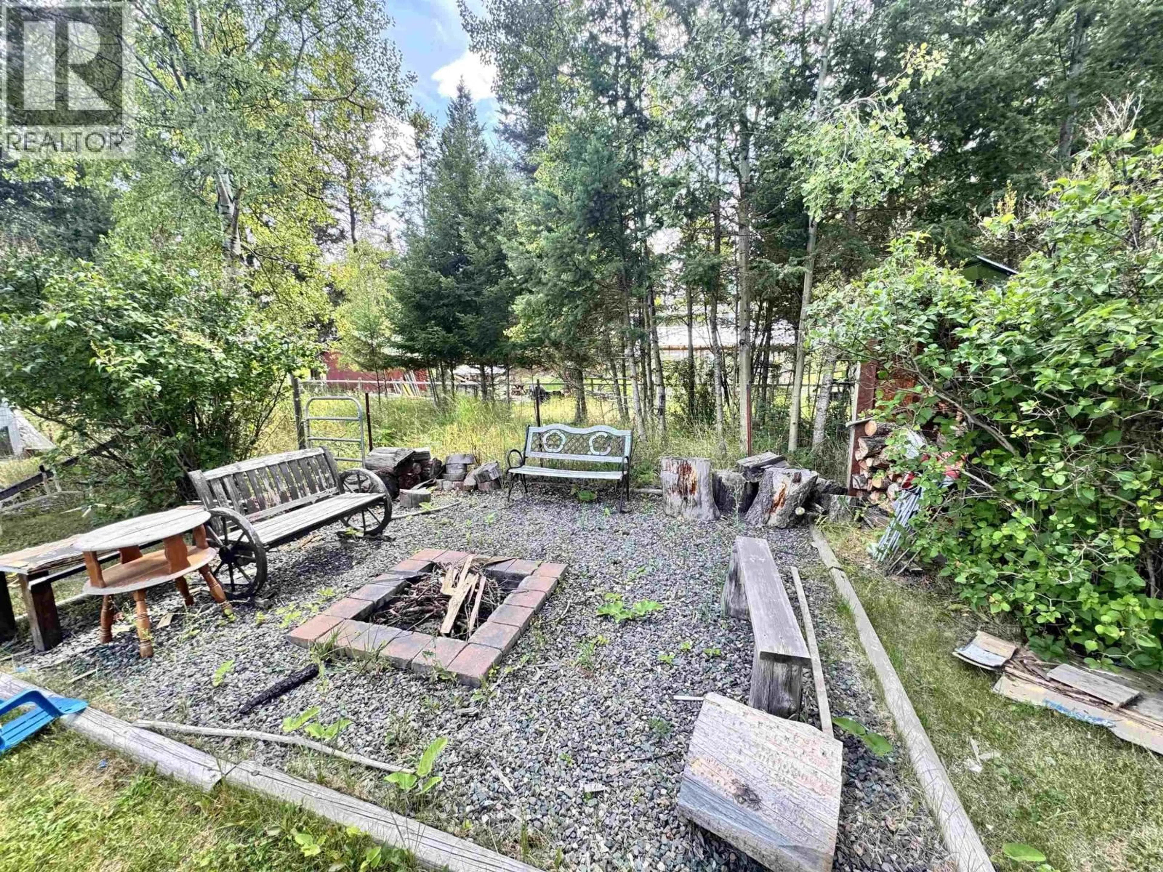 A pic from outside/outdoor area/front of a property/back of a property/a pic from drone, forest/trees view for 4990 DONSLEEQUA ROAD, 108 Mile Ranch British Columbia V0K2Z0