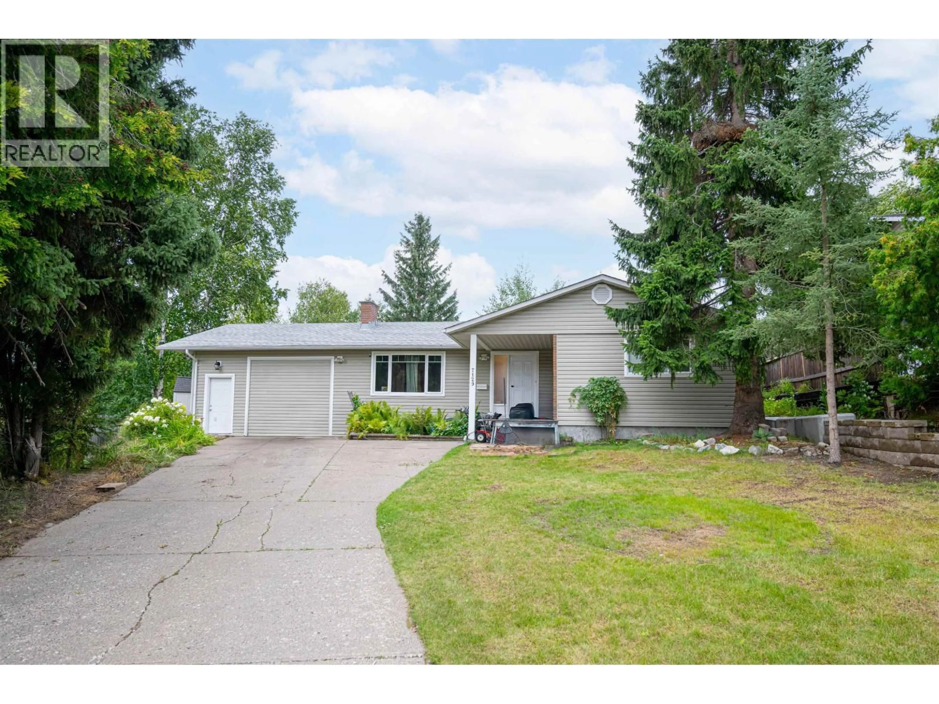 Home with vinyl exterior material, street for 7129 HARTFORD CRESCENT, Prince George British Columbia V2N2W2