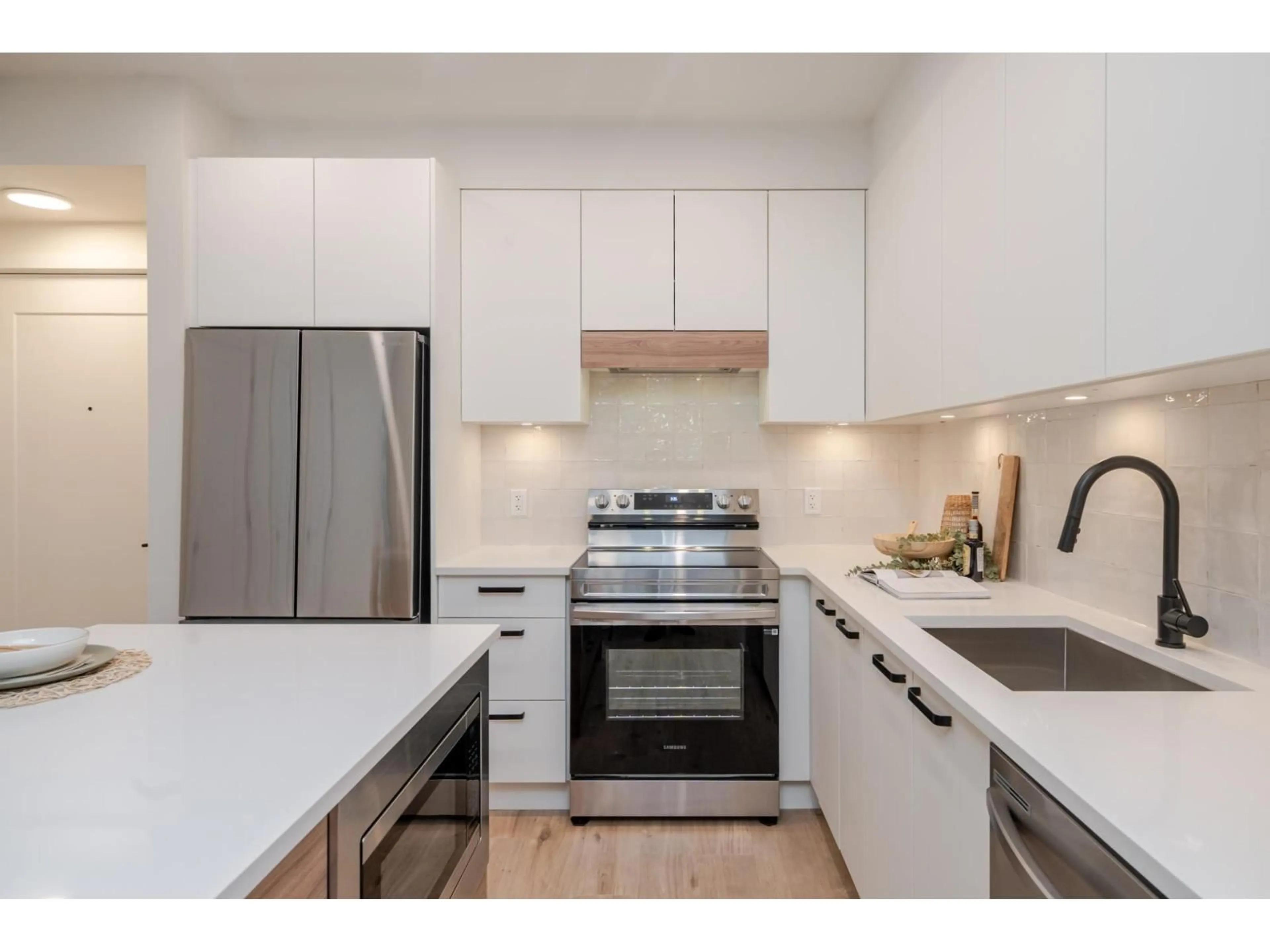 Open concept kitchen, wood/laminate floor for 302 - 33920 BEST, Mission British Columbia V2V7A4