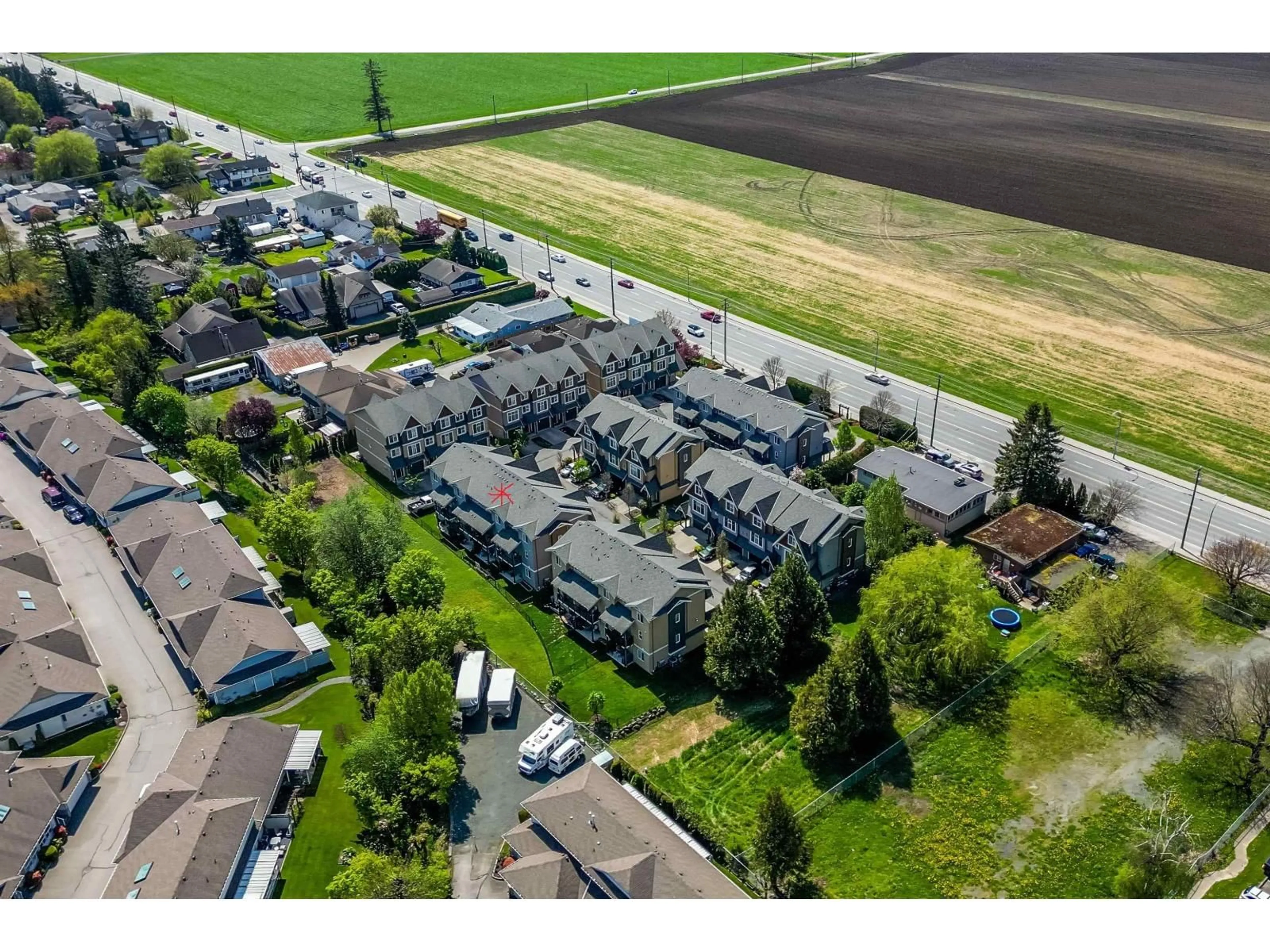 A pic from outside/outdoor area/front of a property/back of a property/a pic from drone, street for 22 - 7428 EVANS ROAD, Chilliwack British Columbia V2R0S5